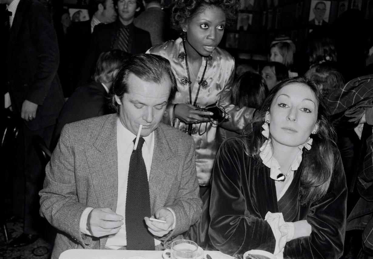 Anjelica Huston seated with Jack Nicholson