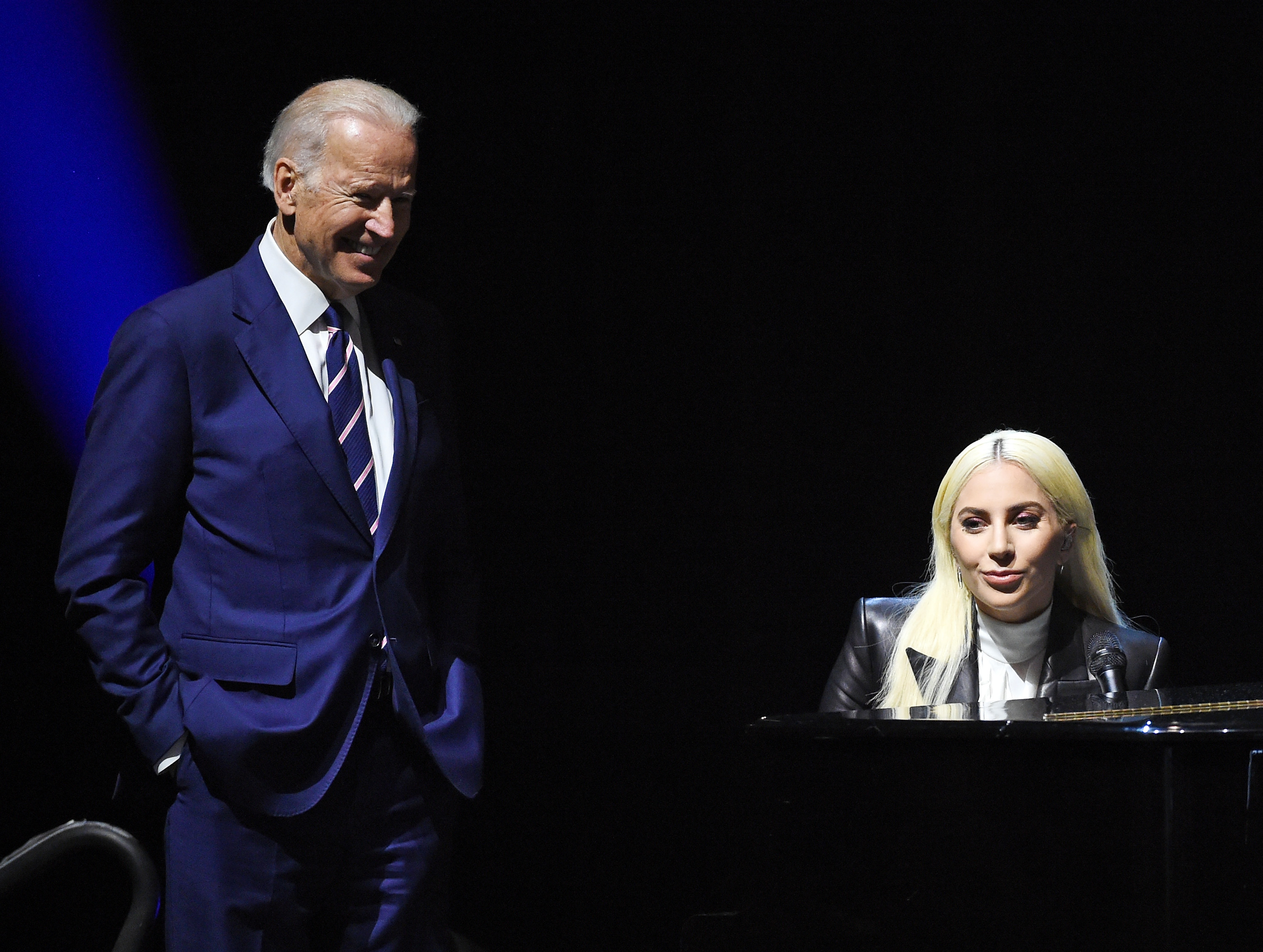 Joe Biden (L) looks on as recording artist Lady Gaga speaks on April 7, 2016, in Las Vegas, Nevada. 