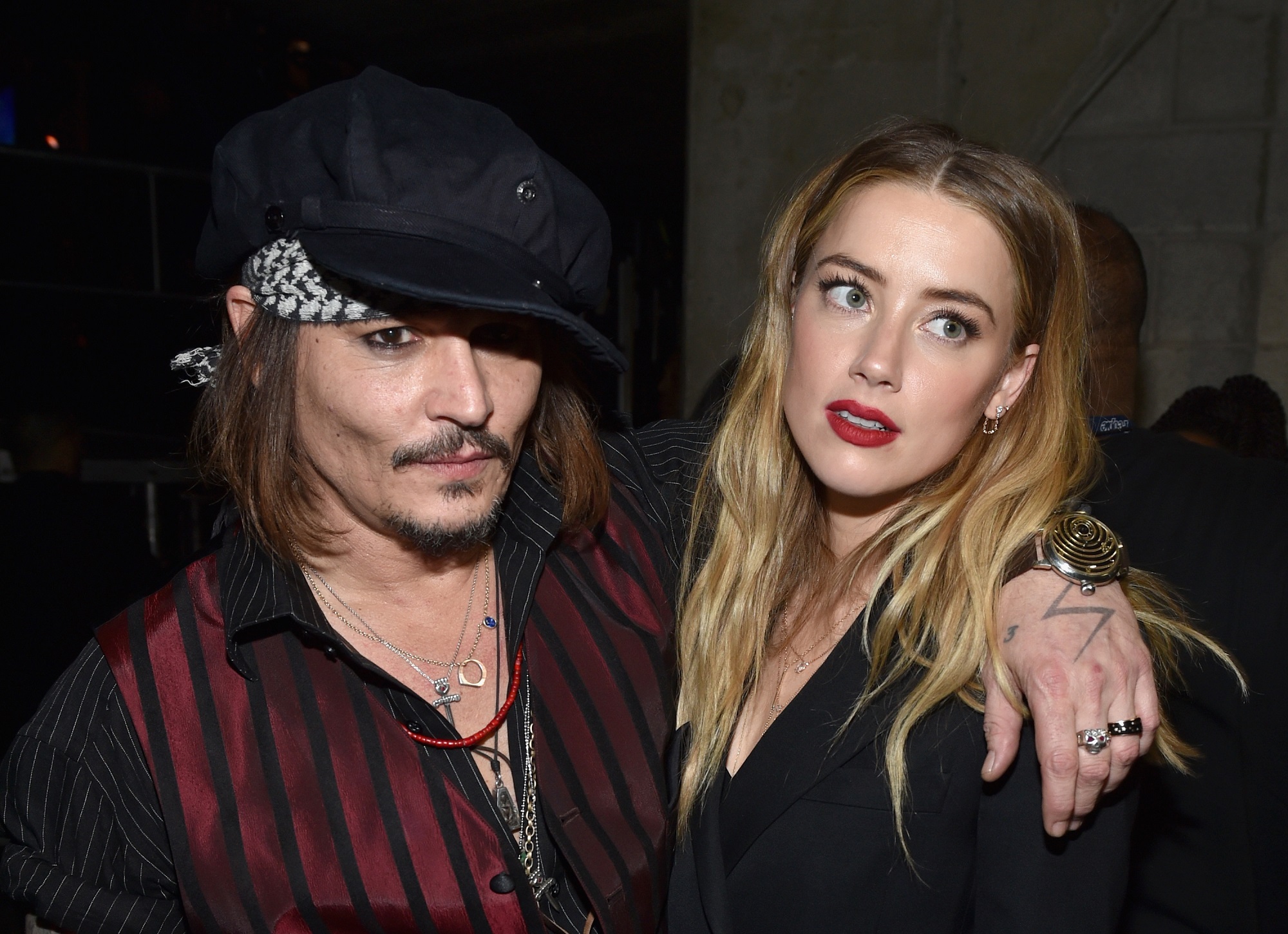 Johnny Depp (L) and Amber Heard attend The 58th GRAMMY Awards at Staples Center on February 15, 2016, in Los Angeles, California. 