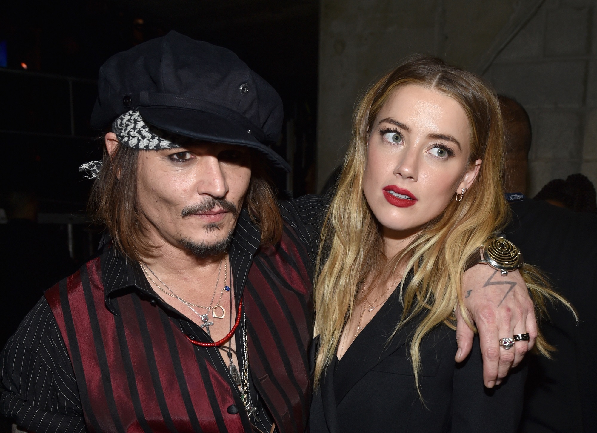 Johnny Depp (L) and Amber Heard attend The 58th GRAMMY Awards at Staples Center on February 15, 2016, in Los Angeles, California.