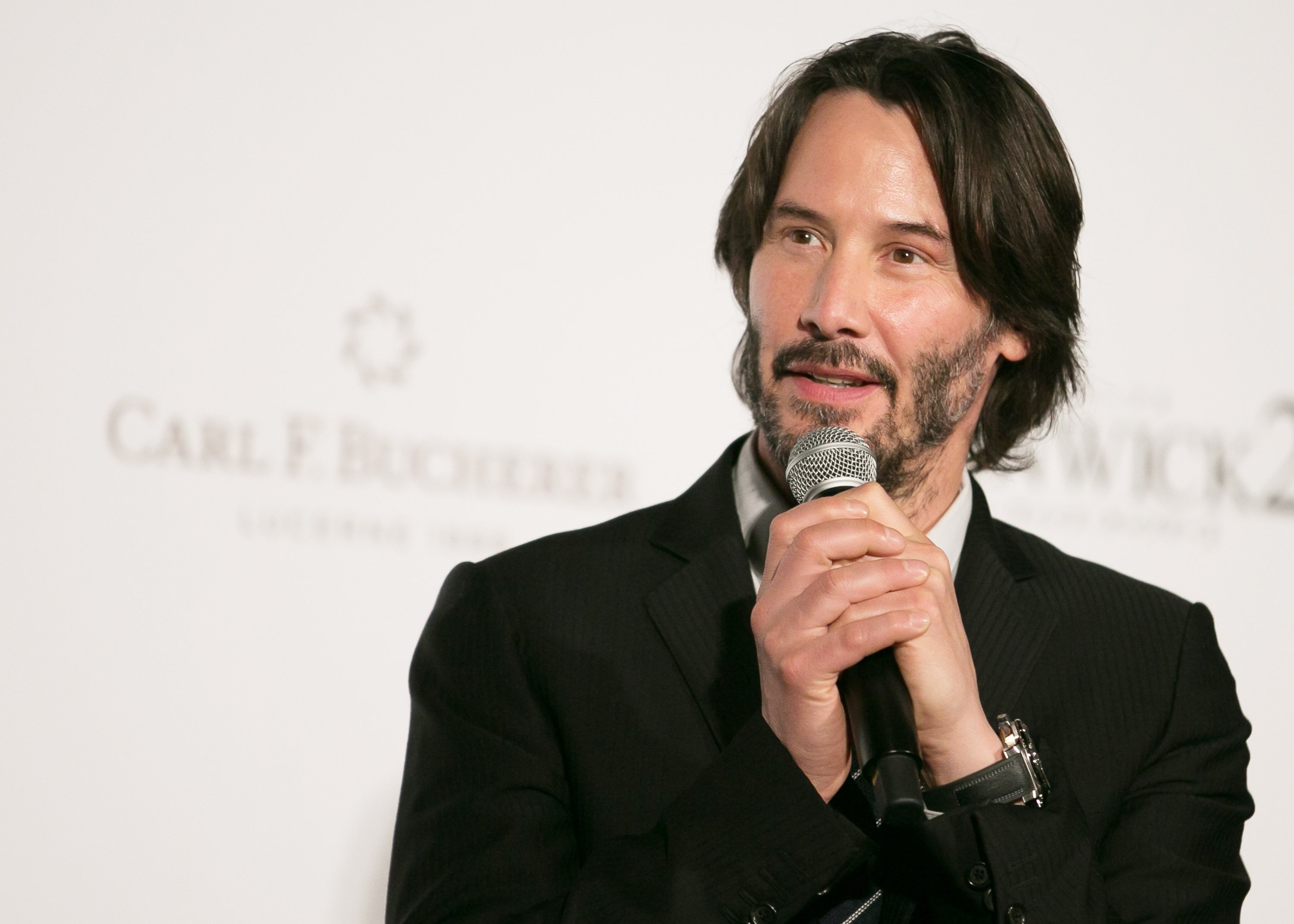 Keanu Reeves with a microphone