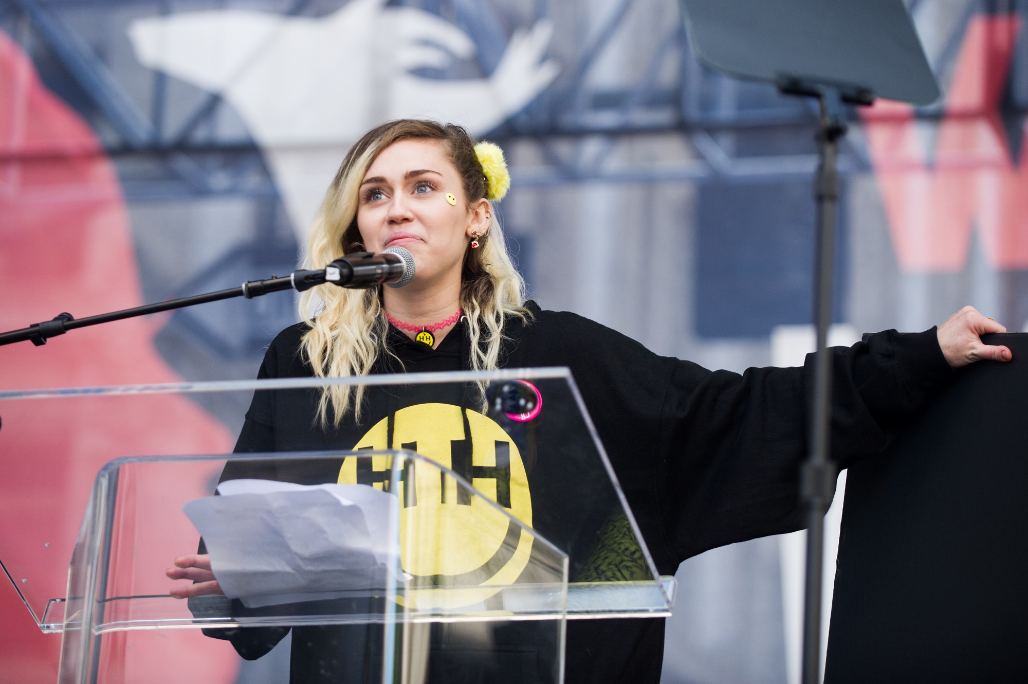 Miley Cyrus speaks onstage at the women's march in Los Angeles on January 21, 2017