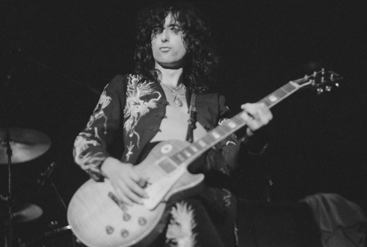 Jimmy Page playing guitar, 1975