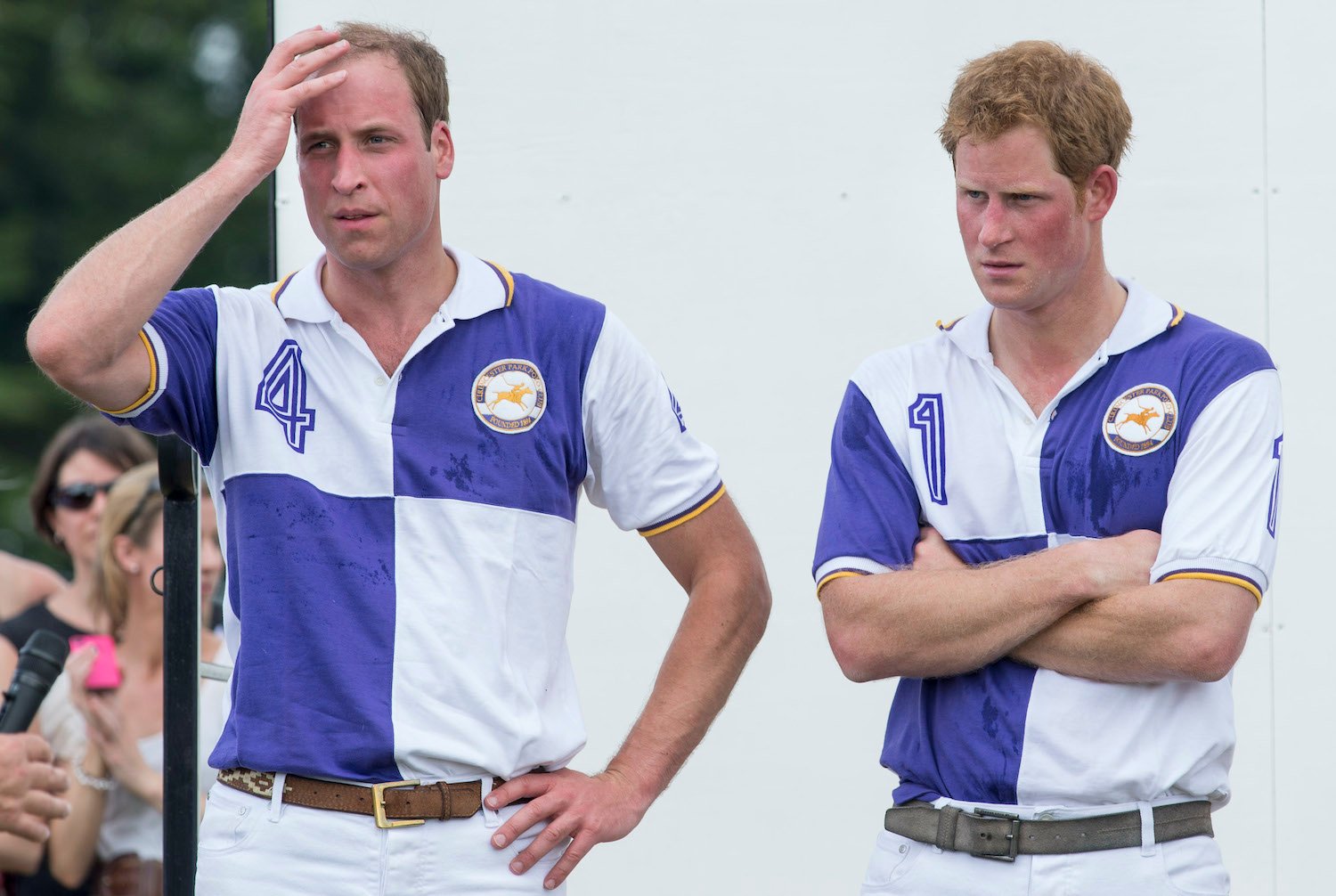 Prince William and Prince Harry attend the presentations after taking part in The Jerudong Trophy at Cirencester Park Polo Club on July 14, 2013