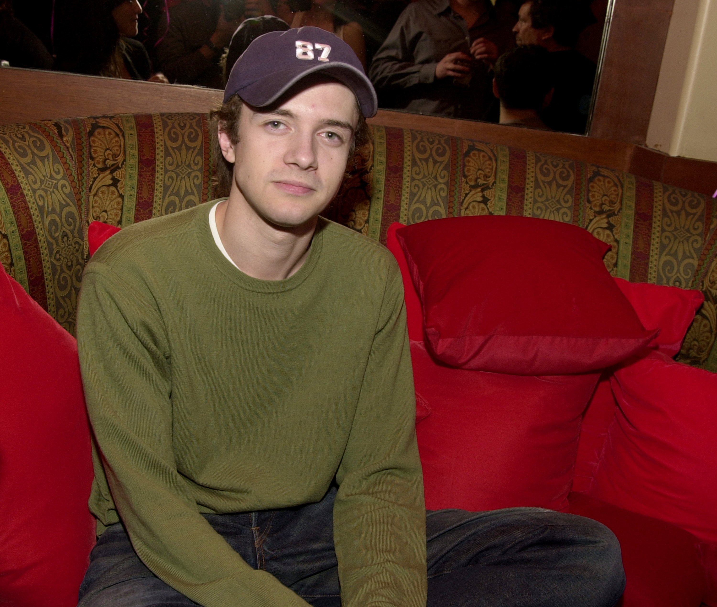 Topher Grace wearing a hat