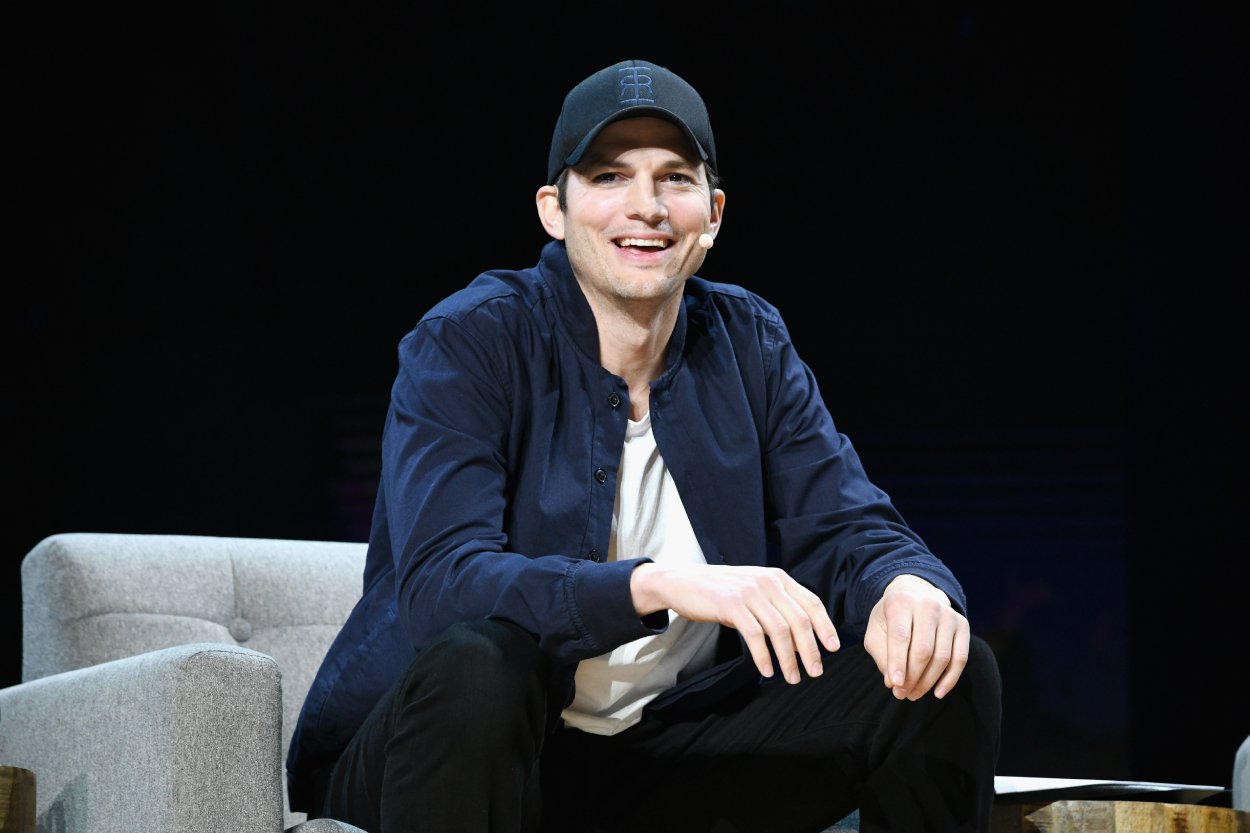 Ashton Kutcher speaking during a conference