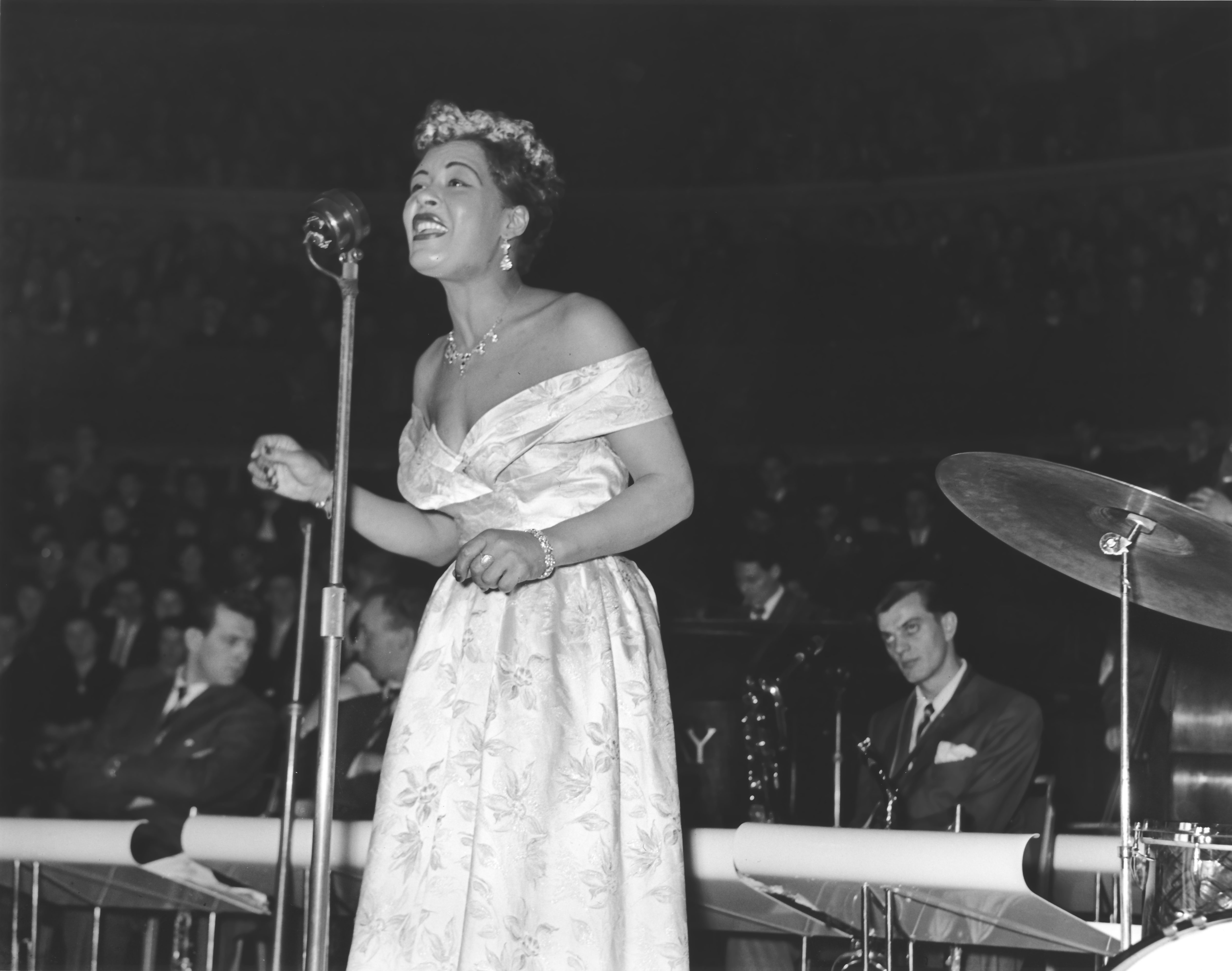 Billie Holiday performing a song on stage