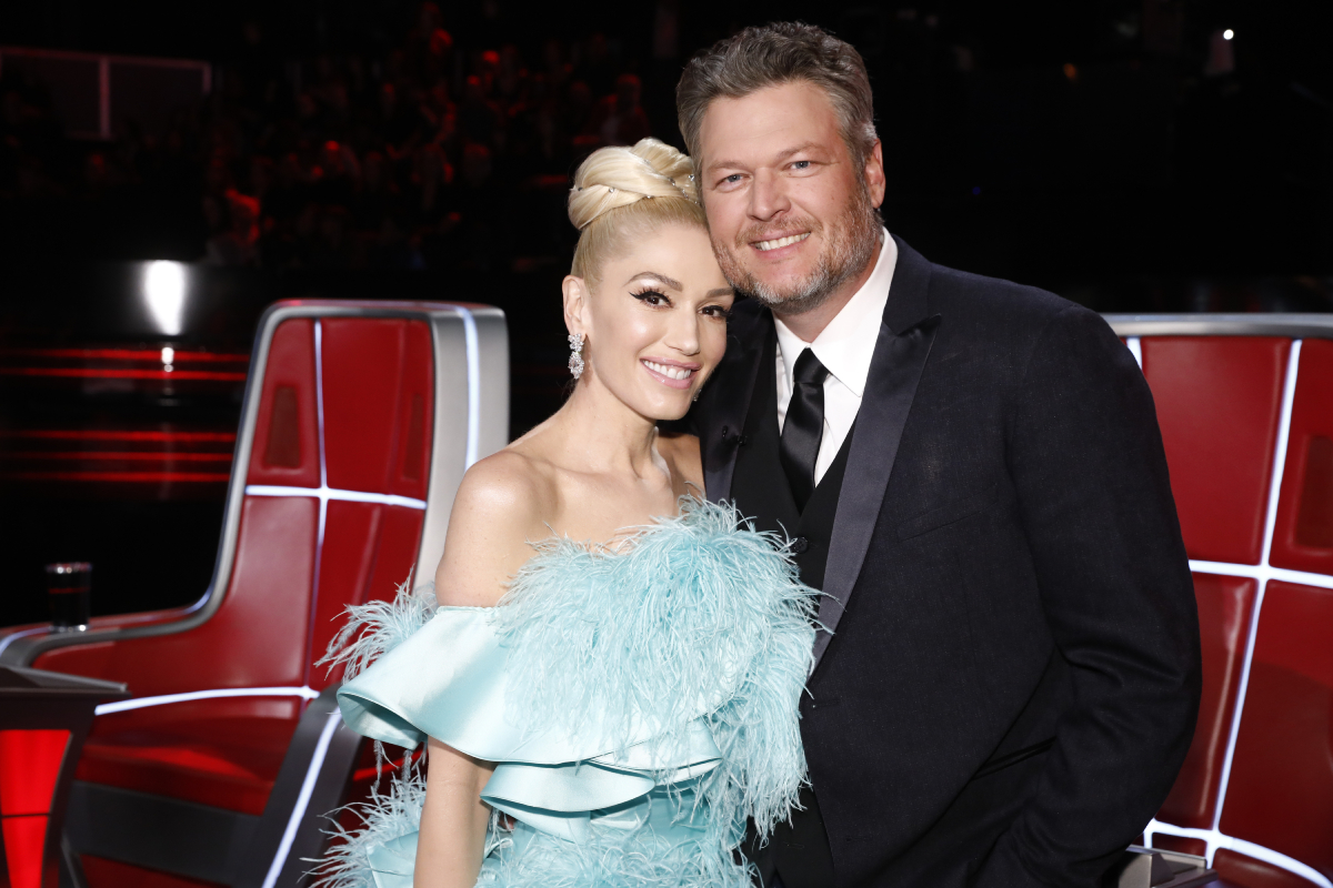 Blake Shelton and Gwen Stefani posing next to each other on 'The Voice' in 2019