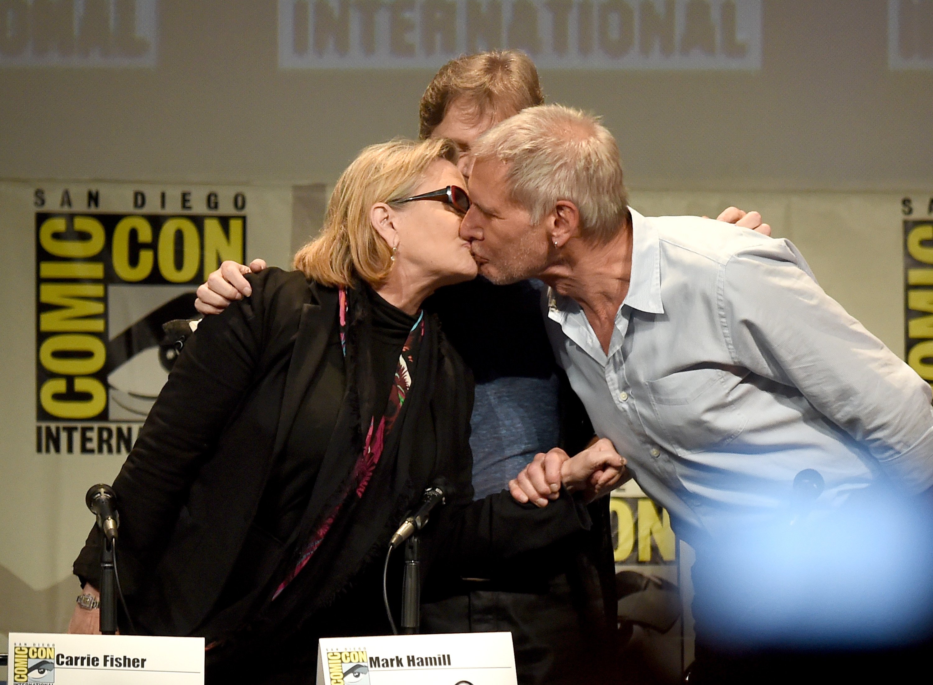Actors Carrie Fisher, Mark Hamill and Harrison Ford pose onstage at the Lucasfilm panel during Comic-Con International 2015 at the San Diego Convention Center on July 10, 2015 in San Diego, California.