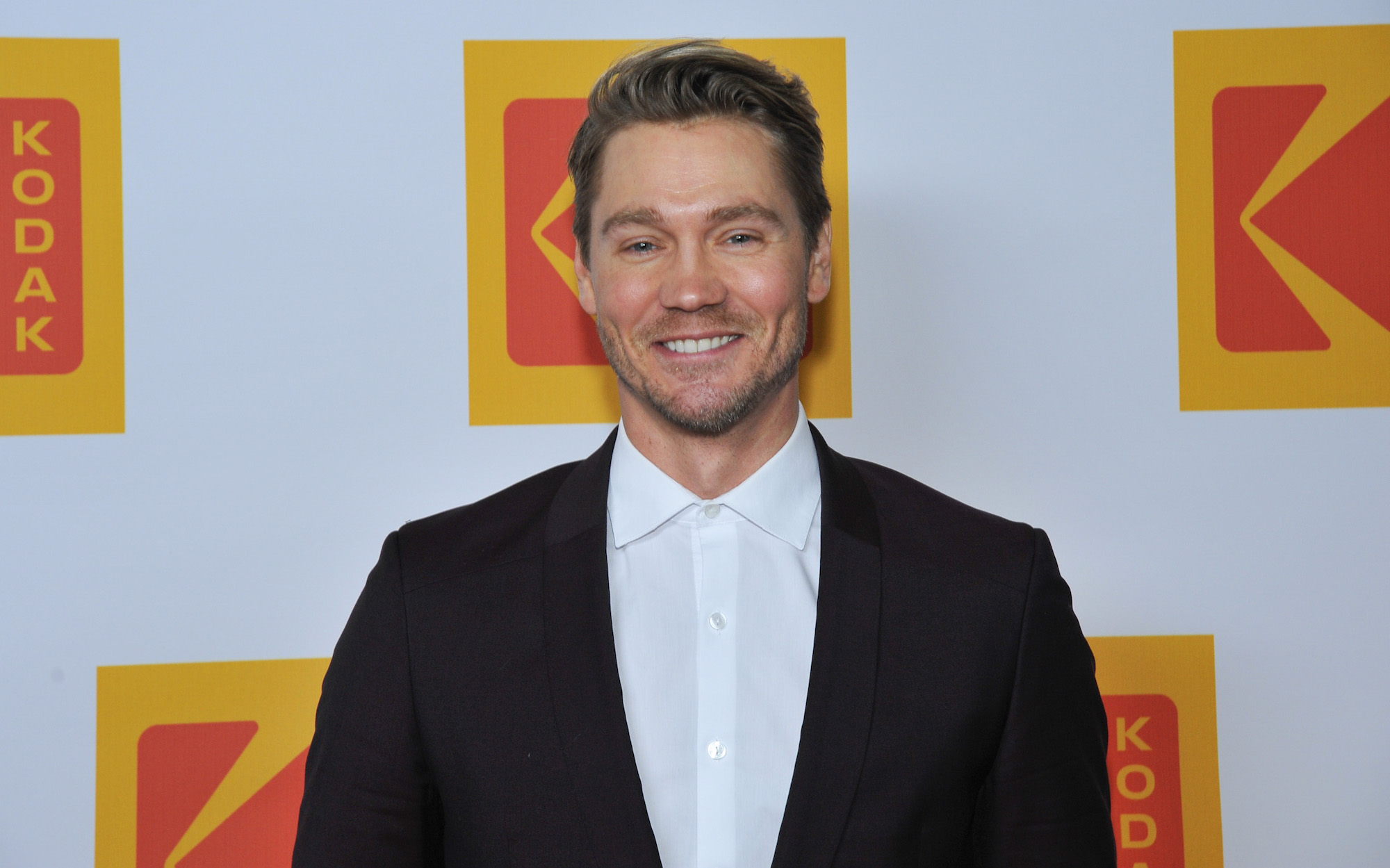 Chad Michael Murray smiling in front of a white background