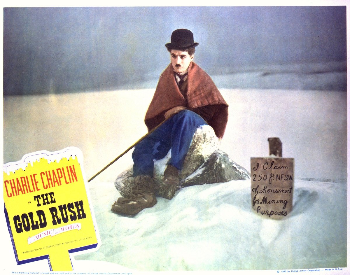 A lobby card for 'The Gold Rush' featuring Charlie Chaplin