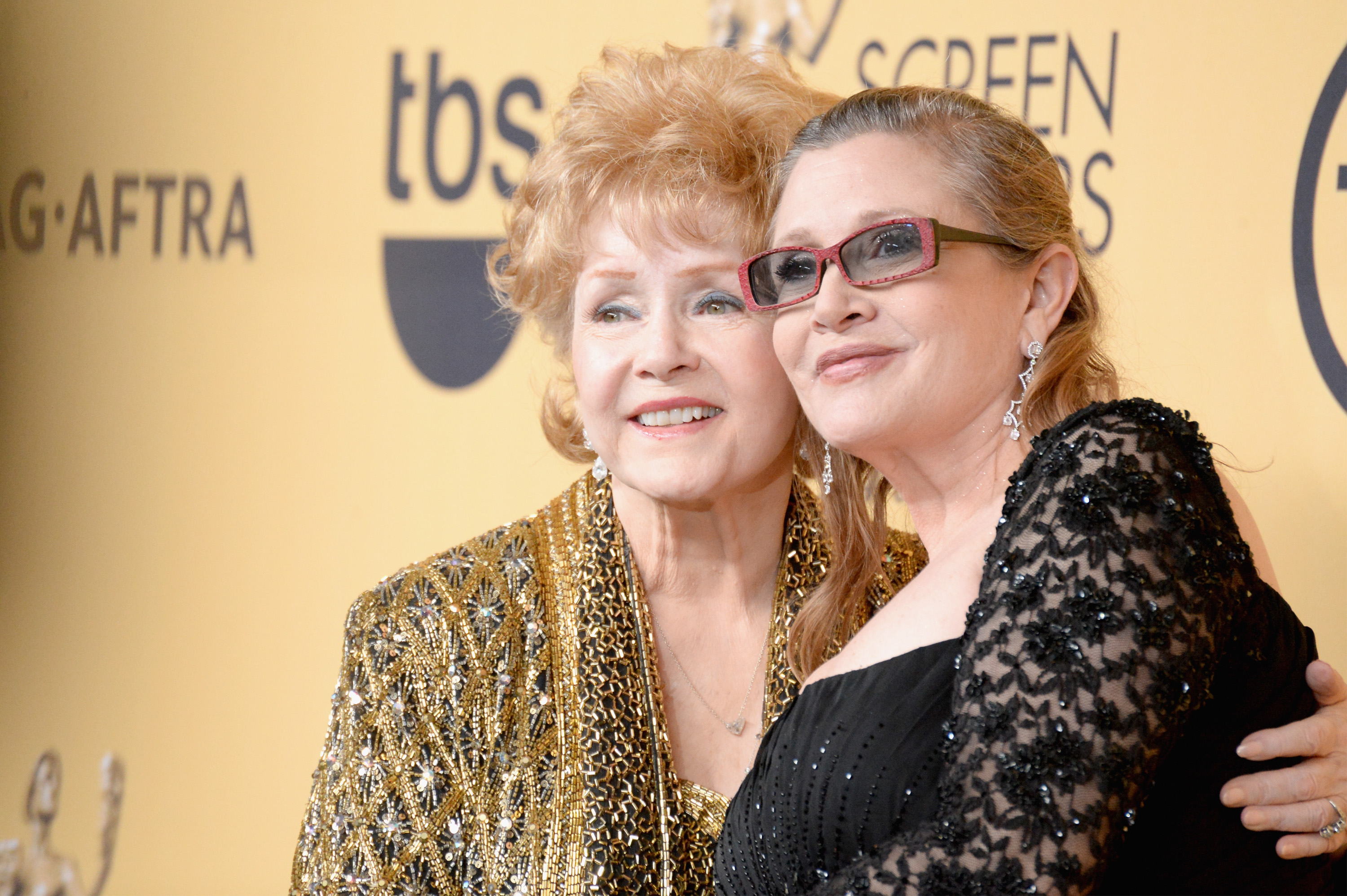 Actresses Debbie Reynolds (L) and Carrie Fisher pose in the press room at the 21st Annual Screen Actors Guild Awards at The Shrine Auditorium on January 25, 2015 in Los Angeles, California.