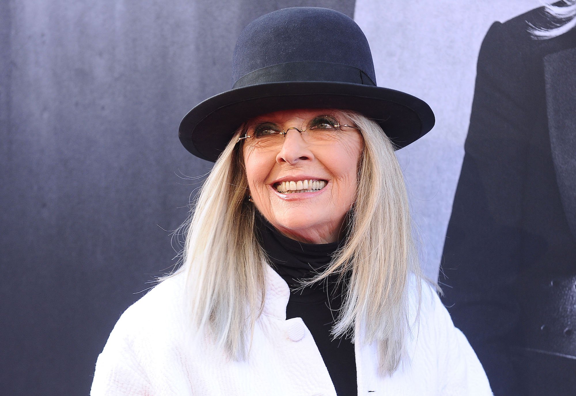 Diane Keaton smiling, looking to the left