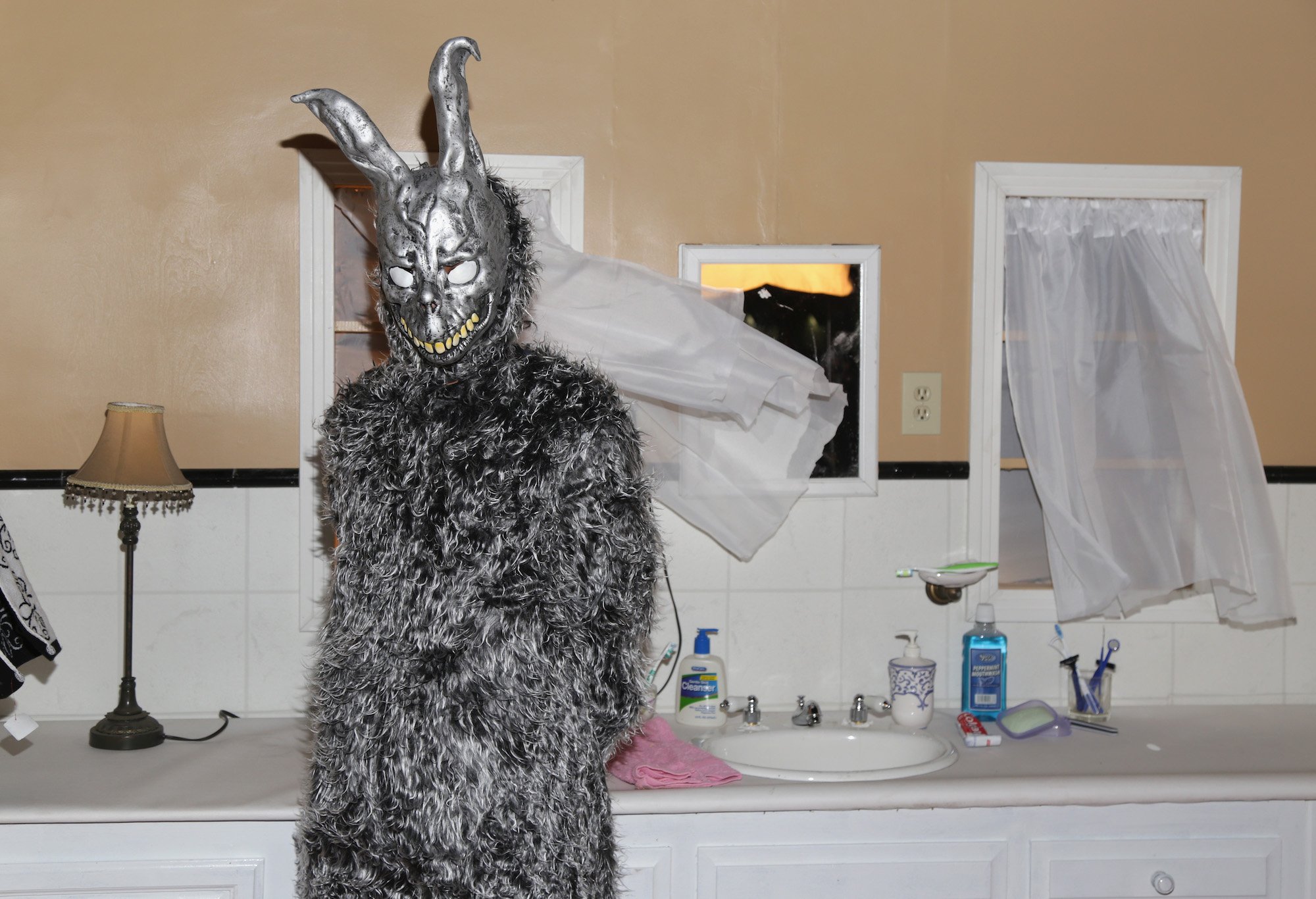 Frank (character in rabbit suit) from 'Donnie Darko' in a bathroom