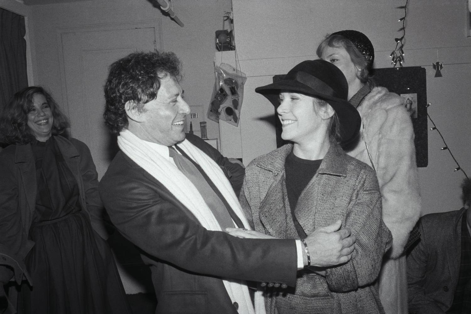 1/3/1983-New York, New York- Proud father Eddie Fisher, 54, greets his daughter Carrie, 26, backstage following her first performance in "Agnes of God." Carrie's mother, Debbie Reynolds, was also on hand but avoided being photographed with her former husband. Carrie replaced Amanda Plummer in the show. Miss Plummer won a Tony Award last season for her performance as the young nun.