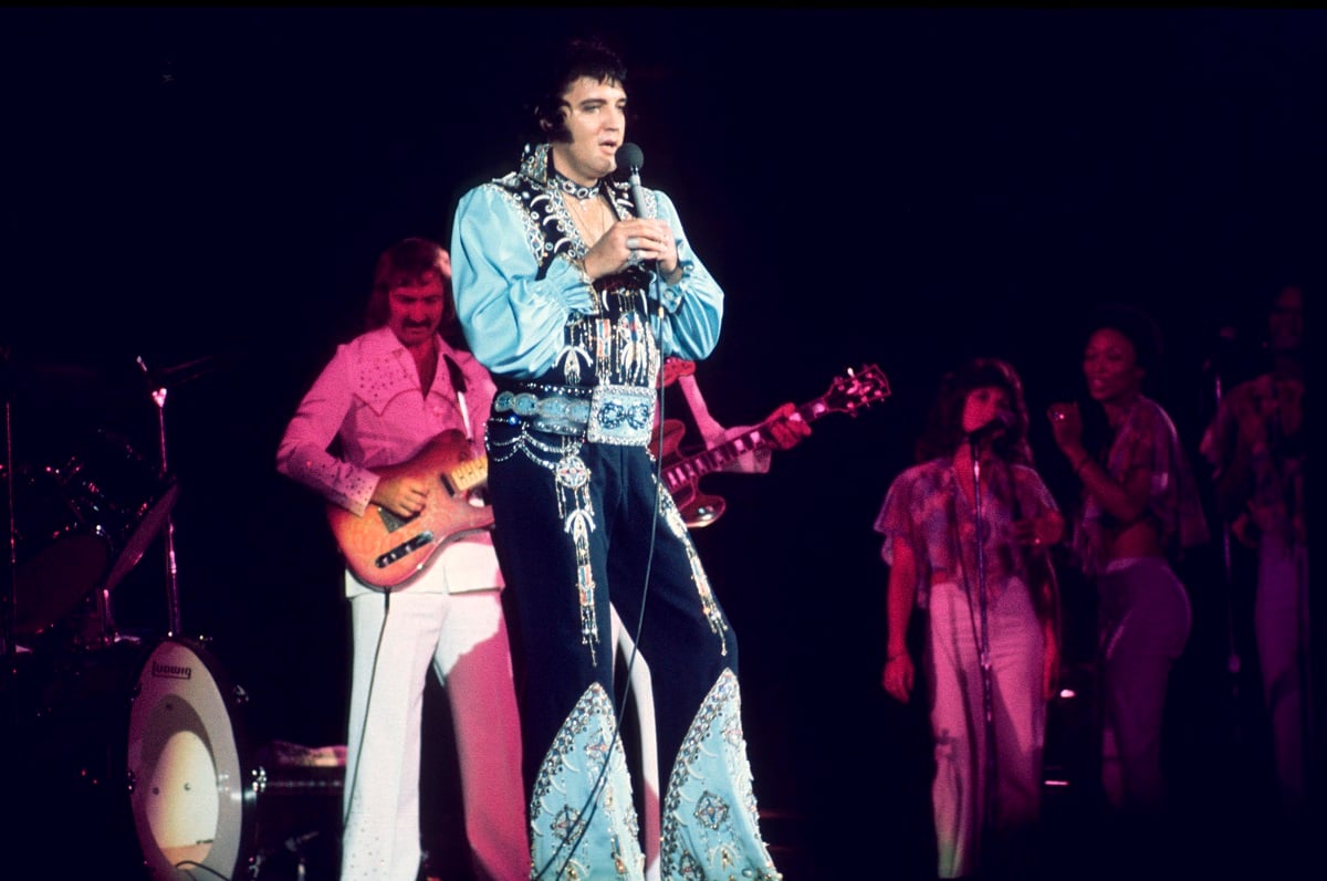 Elvis Presley performing with James Burton and the TCB Band