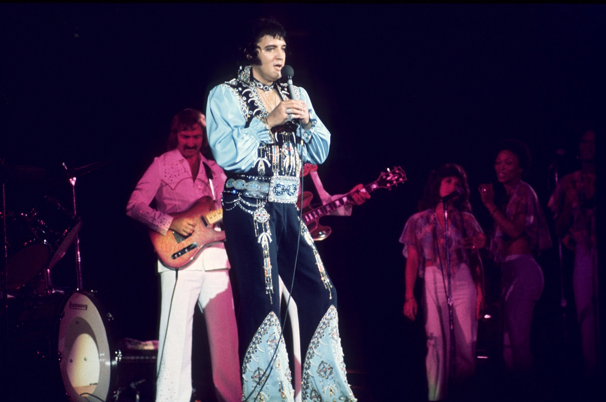 Elvis Presley performing with James Burton and the TCB Band