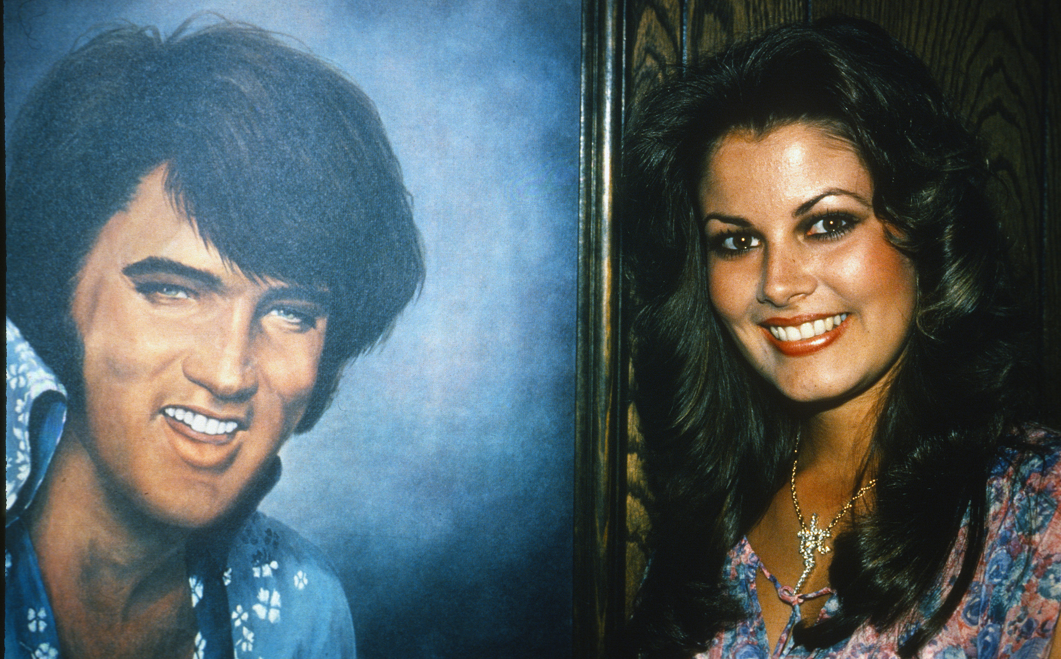 Ginger Alden, fiancee of Elvis Presley and the last person to see him alive, stands beside a portrait of Elvis Presley on April 1, 1978
