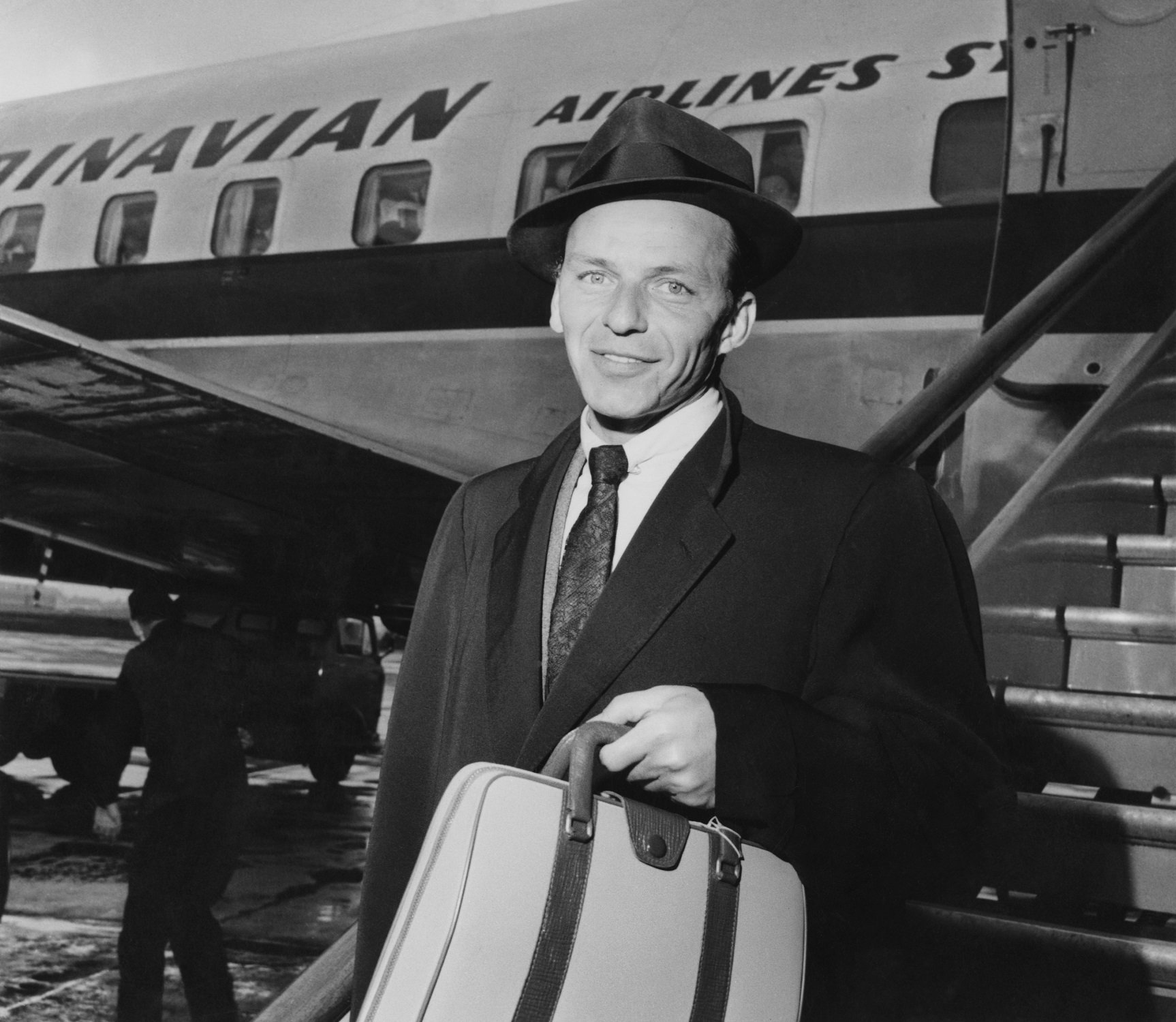 Frank Sinatra arriving at the airport in 1956