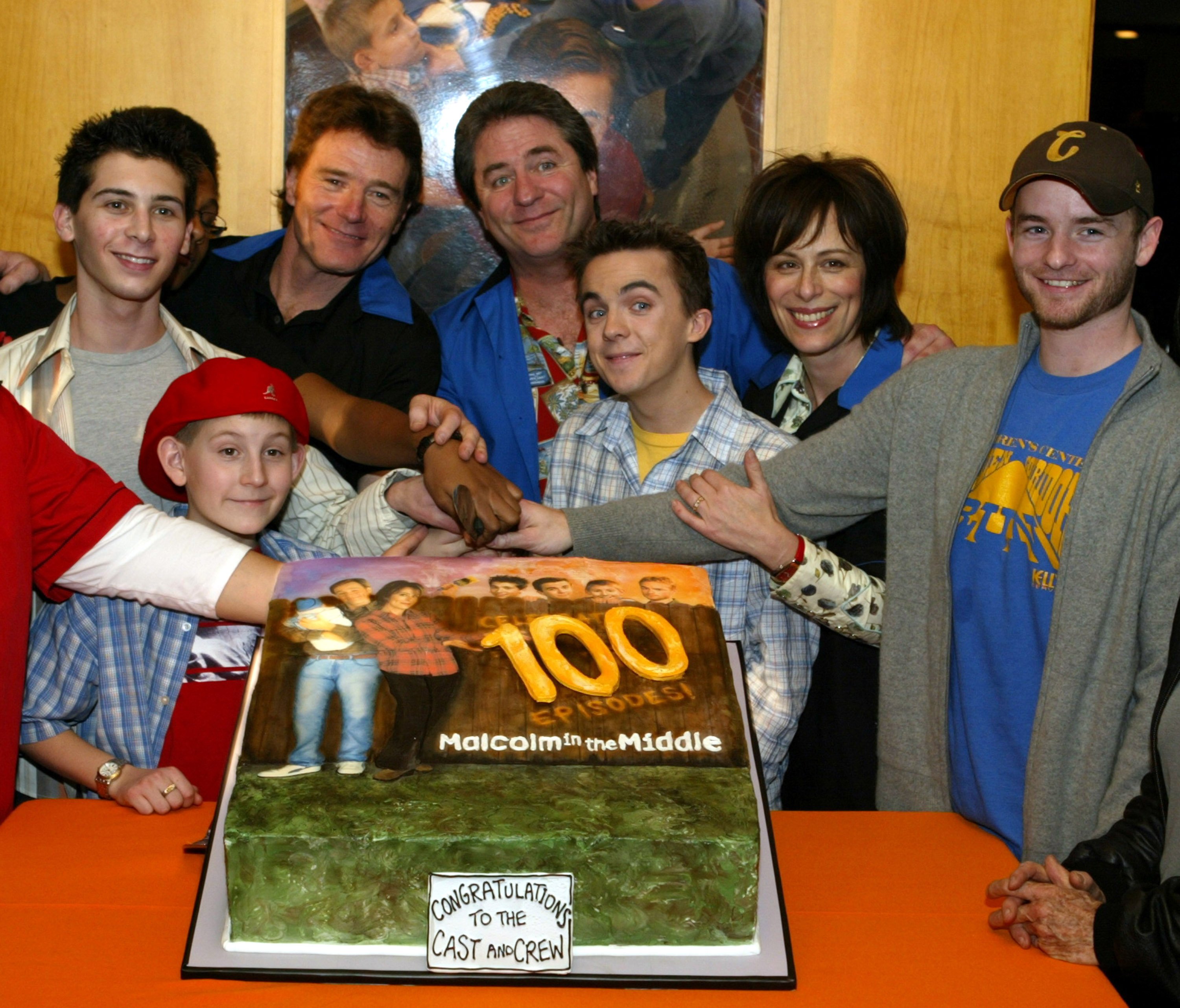 Linwood Boomer, rear center, with the cast of 'Malcolm in the Middle' celebrating the show's 100th episode