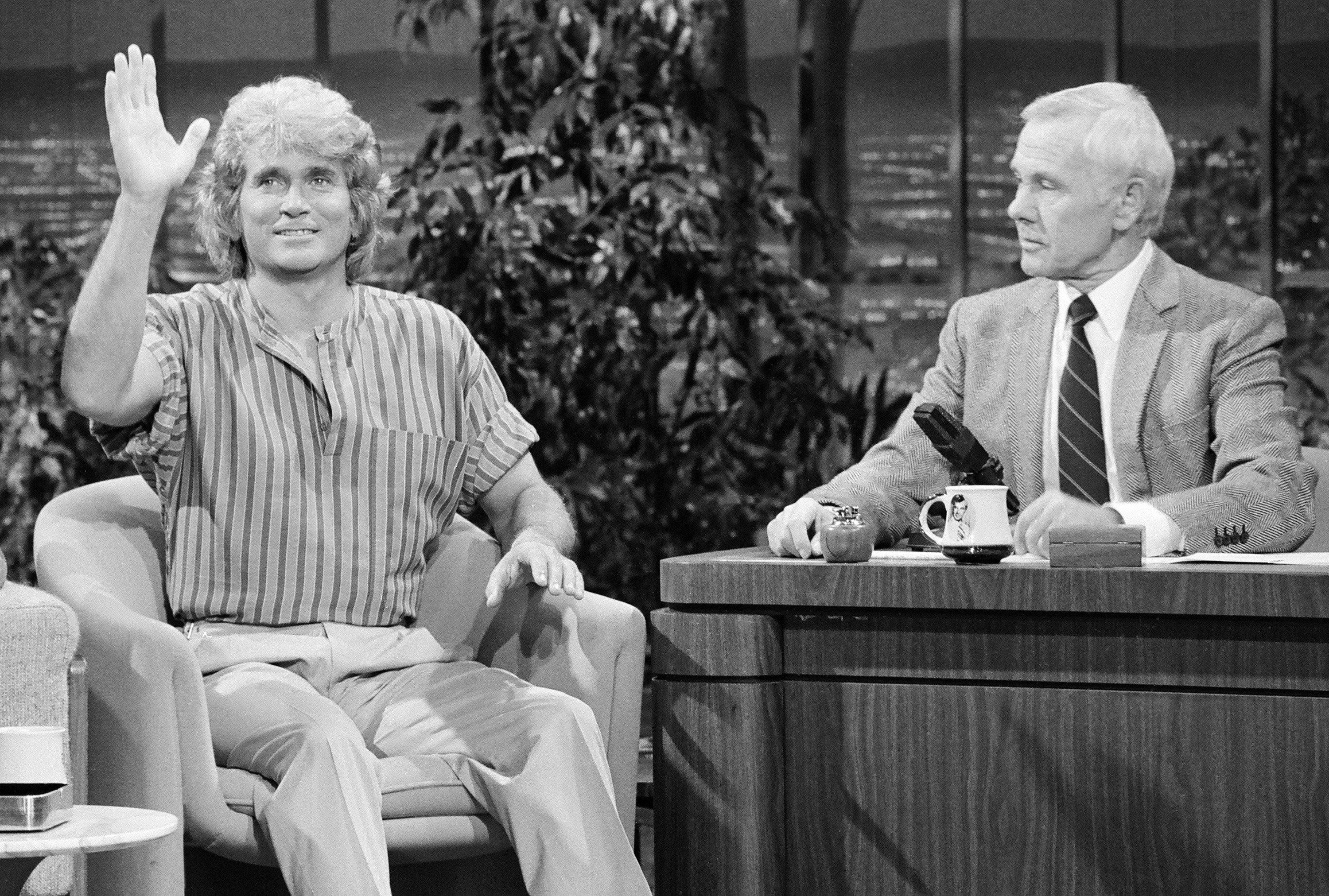Michael Landon, left, with Johnny Carson in 1983
