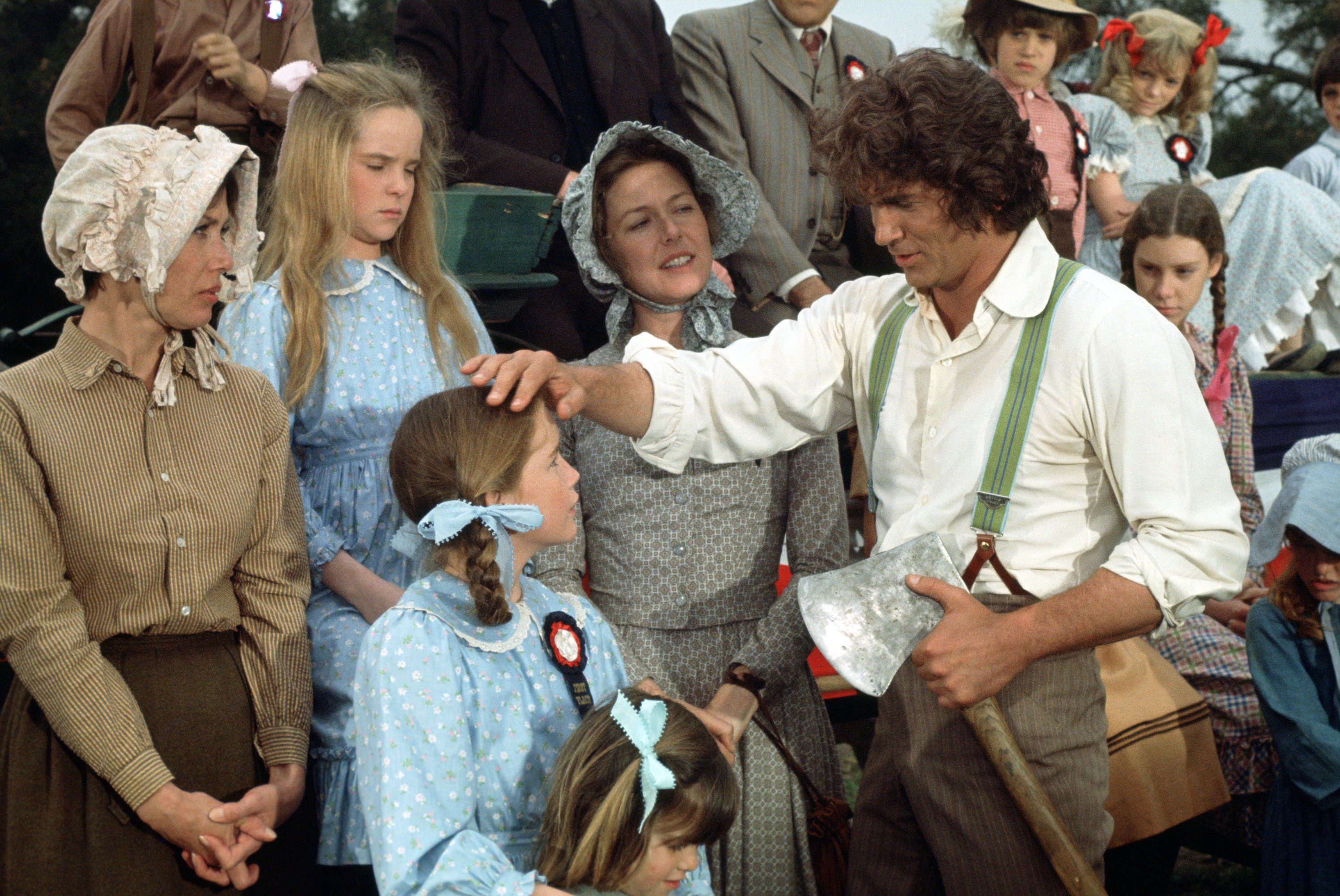 Michael Landon, right, on the set of 'Little House' with cast, 1975