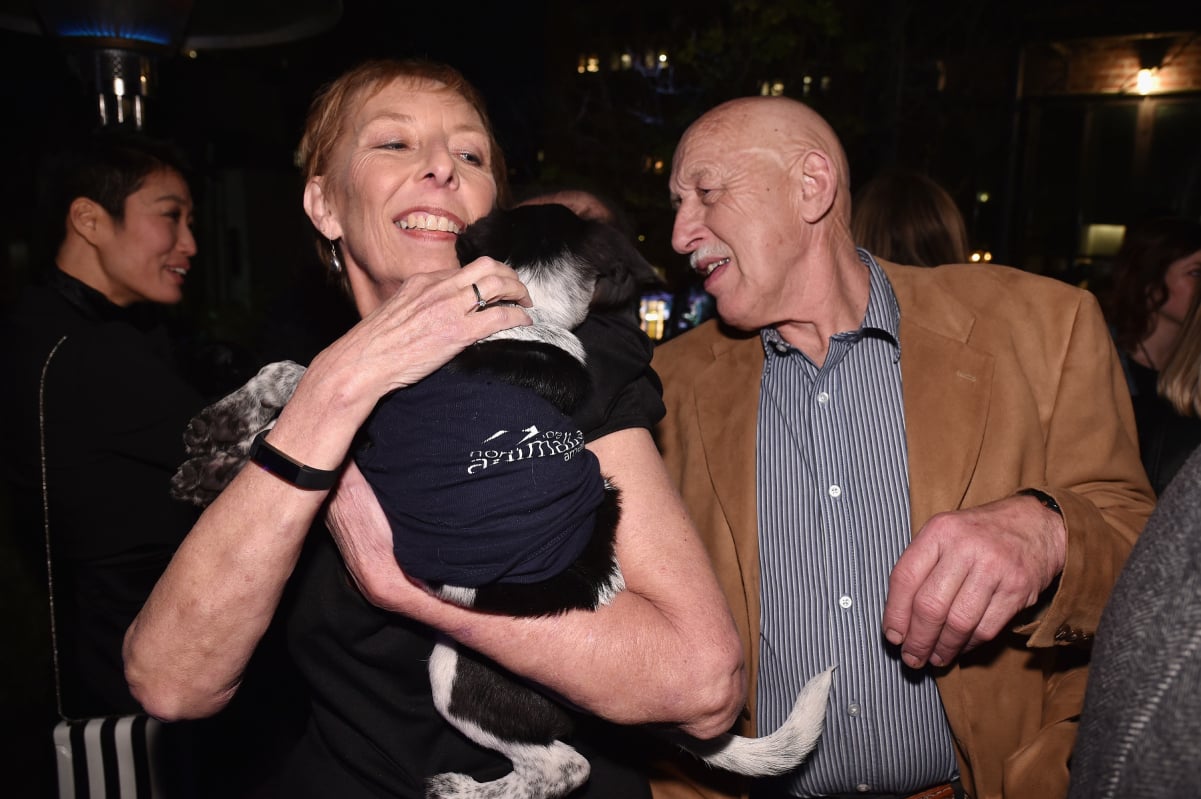 Dr. Jan Pol, right, with his wife Diane and a furry friend