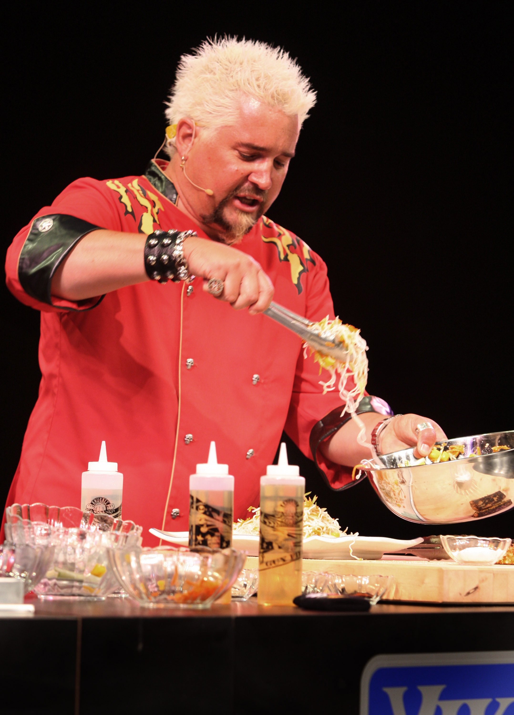 Guy Fieri does a cooking demo on stage in the Circus Maximus Theater