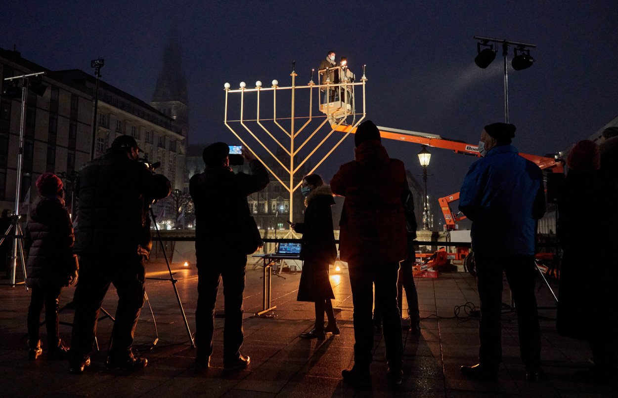 People gather around to celebrate Hanukkah