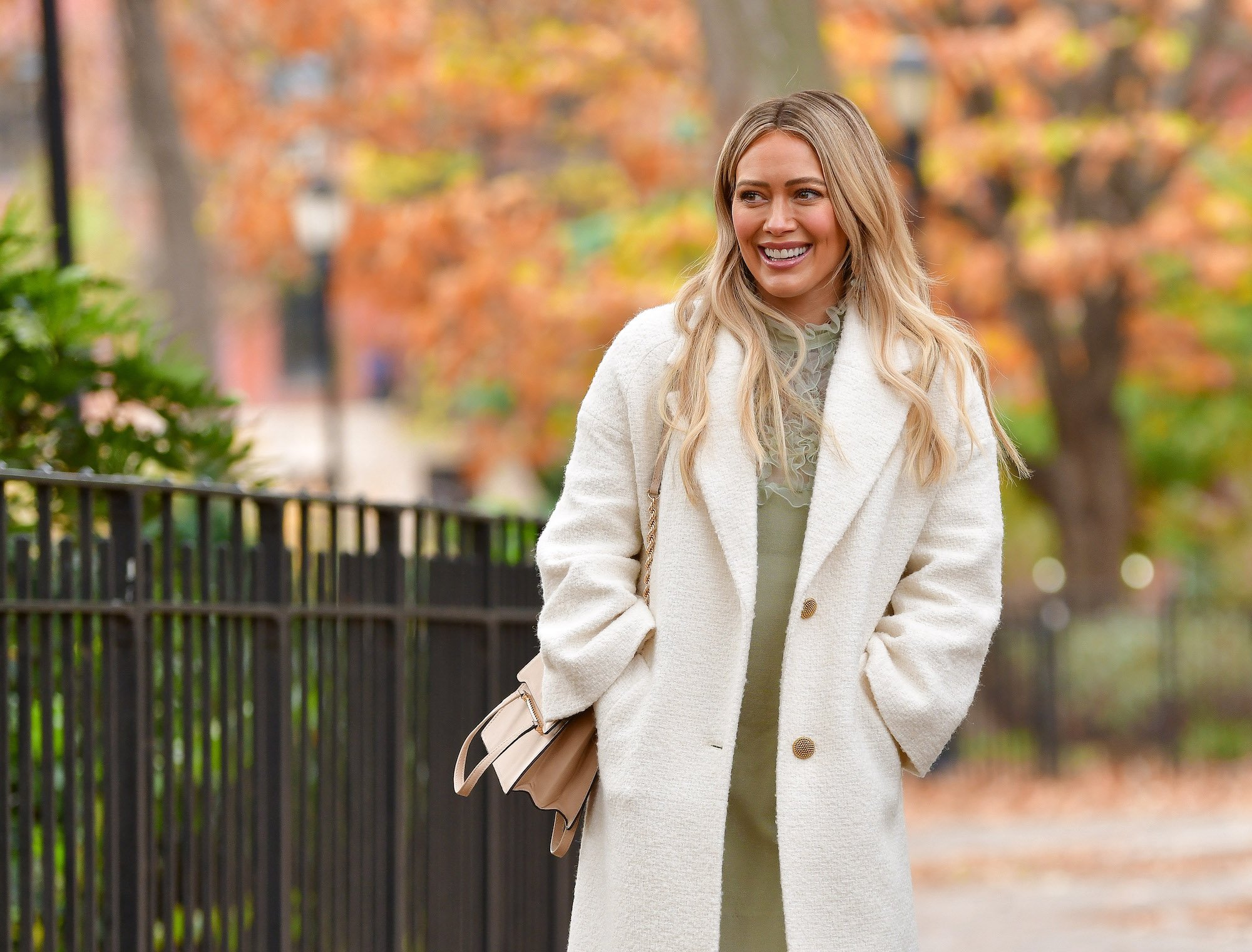 Hilary Duff smiling, looking off to the side