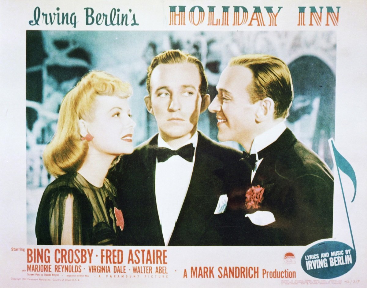A lobby card for Mark Sandrich's 1942 film musical 'Holiday Inn' with Marjorie Reynolds, Bing Crosby, and Fred Astaire