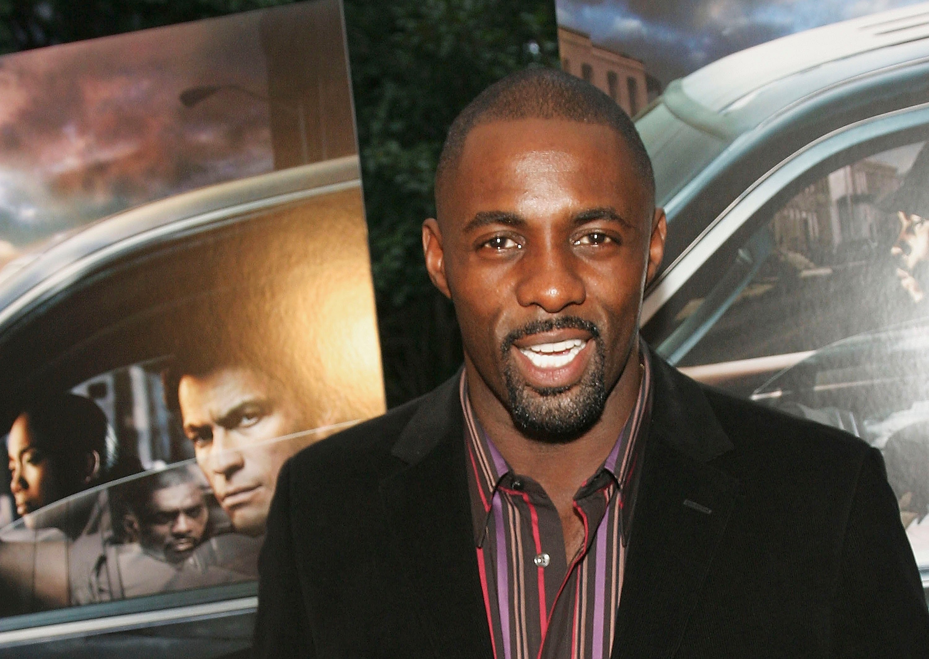 Idris Elba smiles for a photo at the season premiere of 'The Wire'