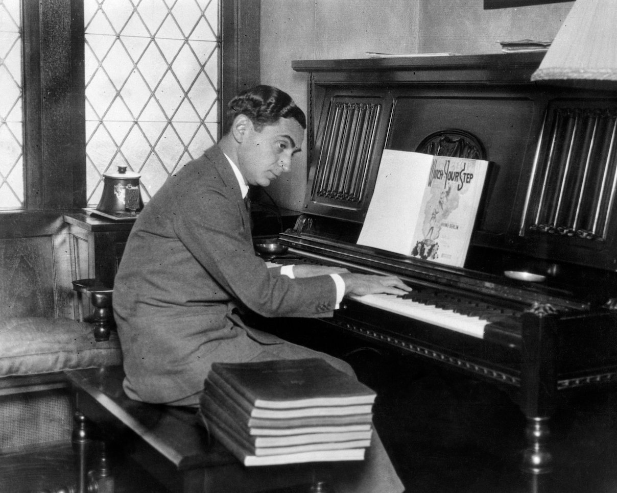 Irving Berlin practices music on the piano for his debut musical
