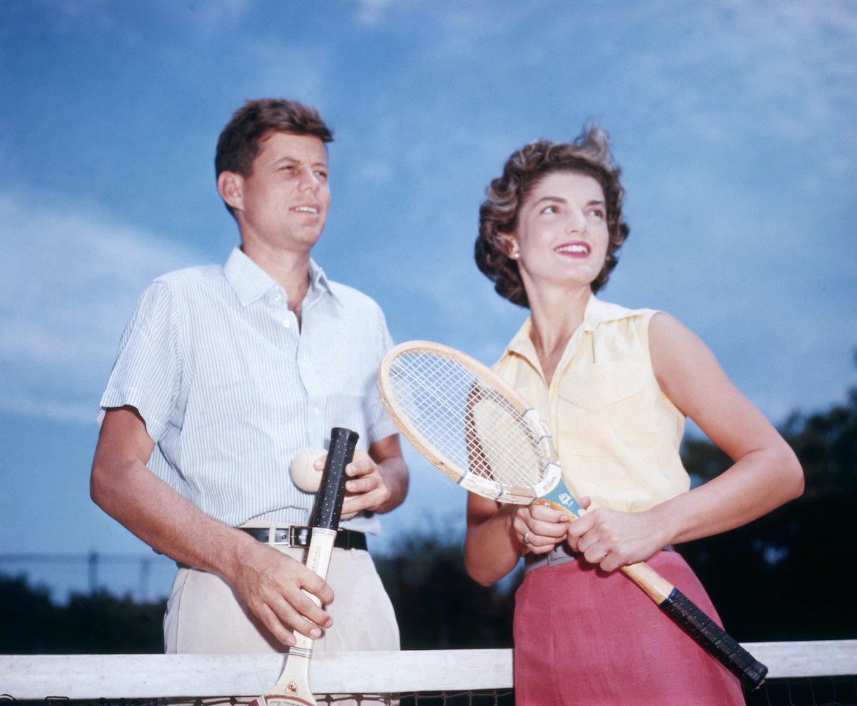Senator John Kennedy and his fiancee Jacqueline Bouvier play tennis