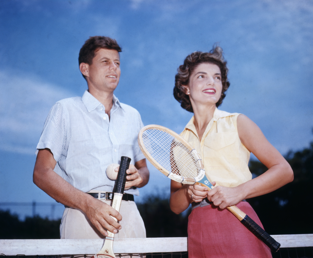 Senator John Kennedy and his fiancee Jacqueline Bouvier play tennis