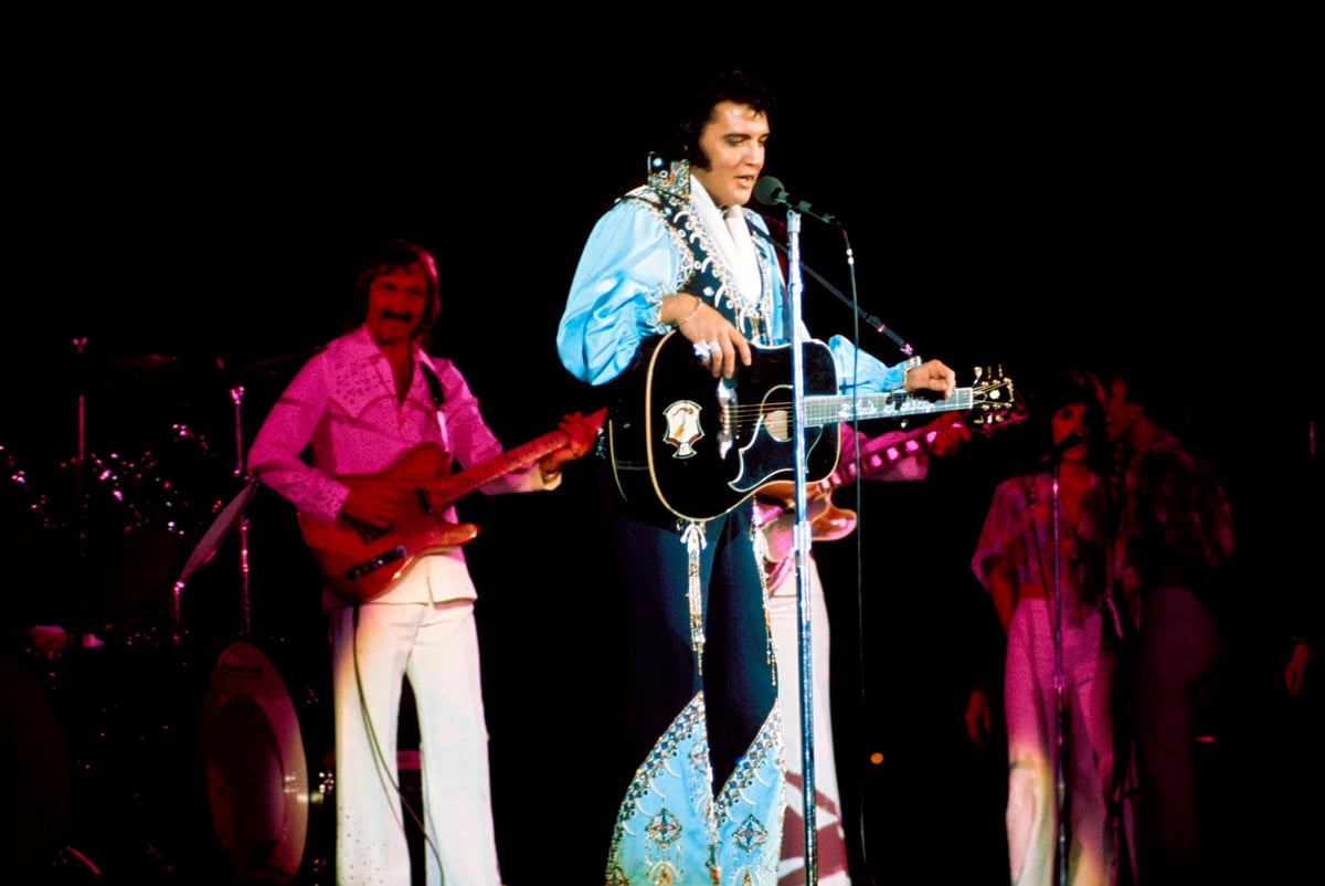 James Burton and Elvis Presley performing