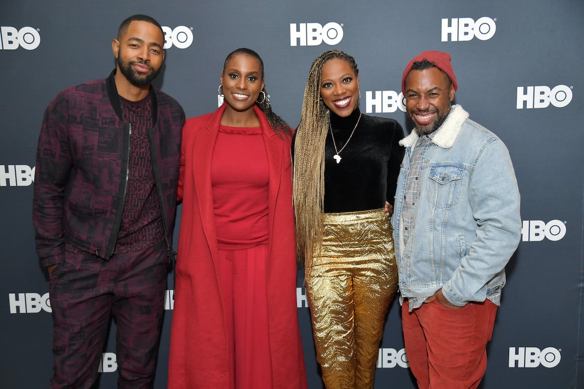 Some of the cast and crew of HBO's 'Insecure' pose for a photo on the red carpet