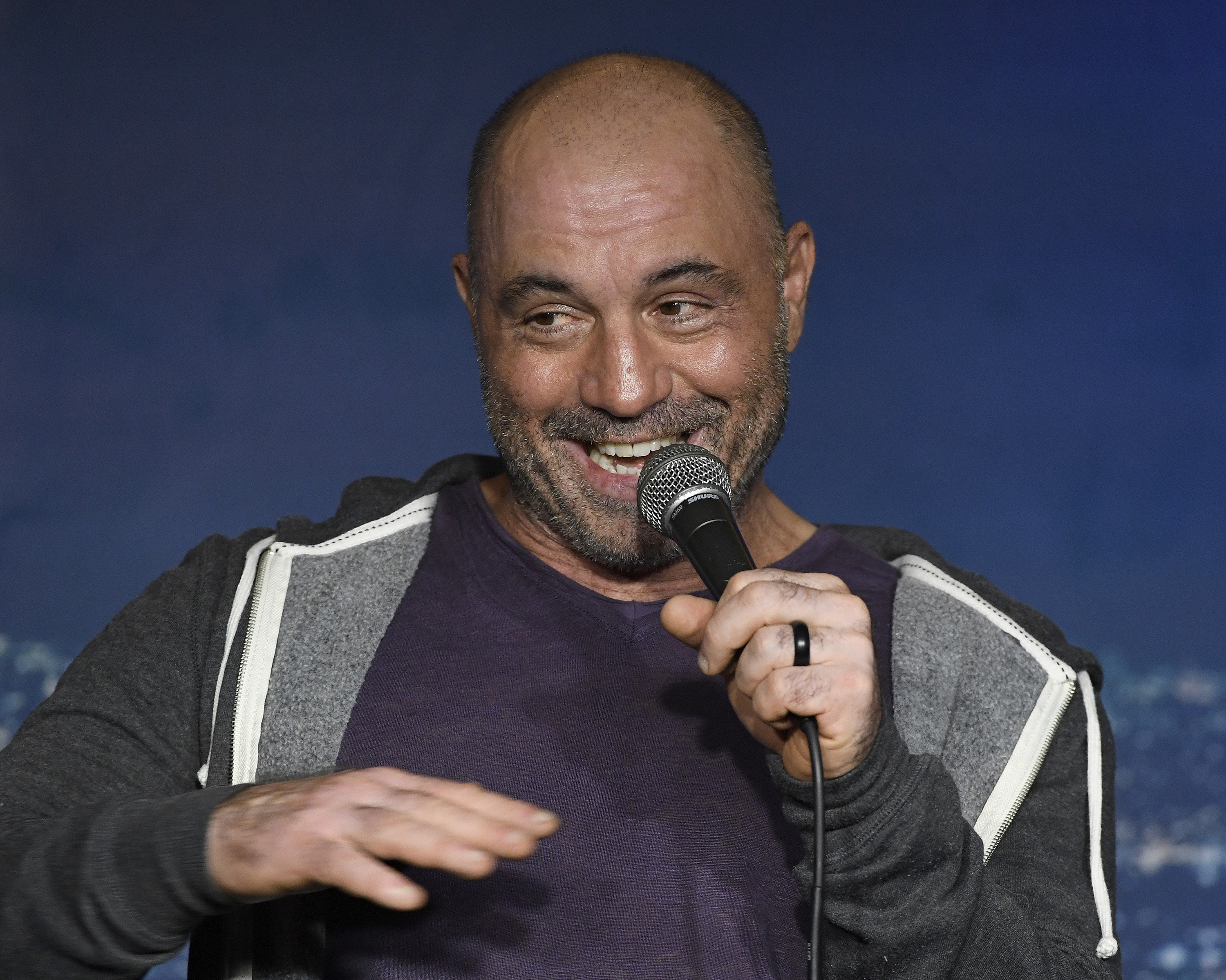 Joe Rogan talks to the crowd during a stand up comedy show