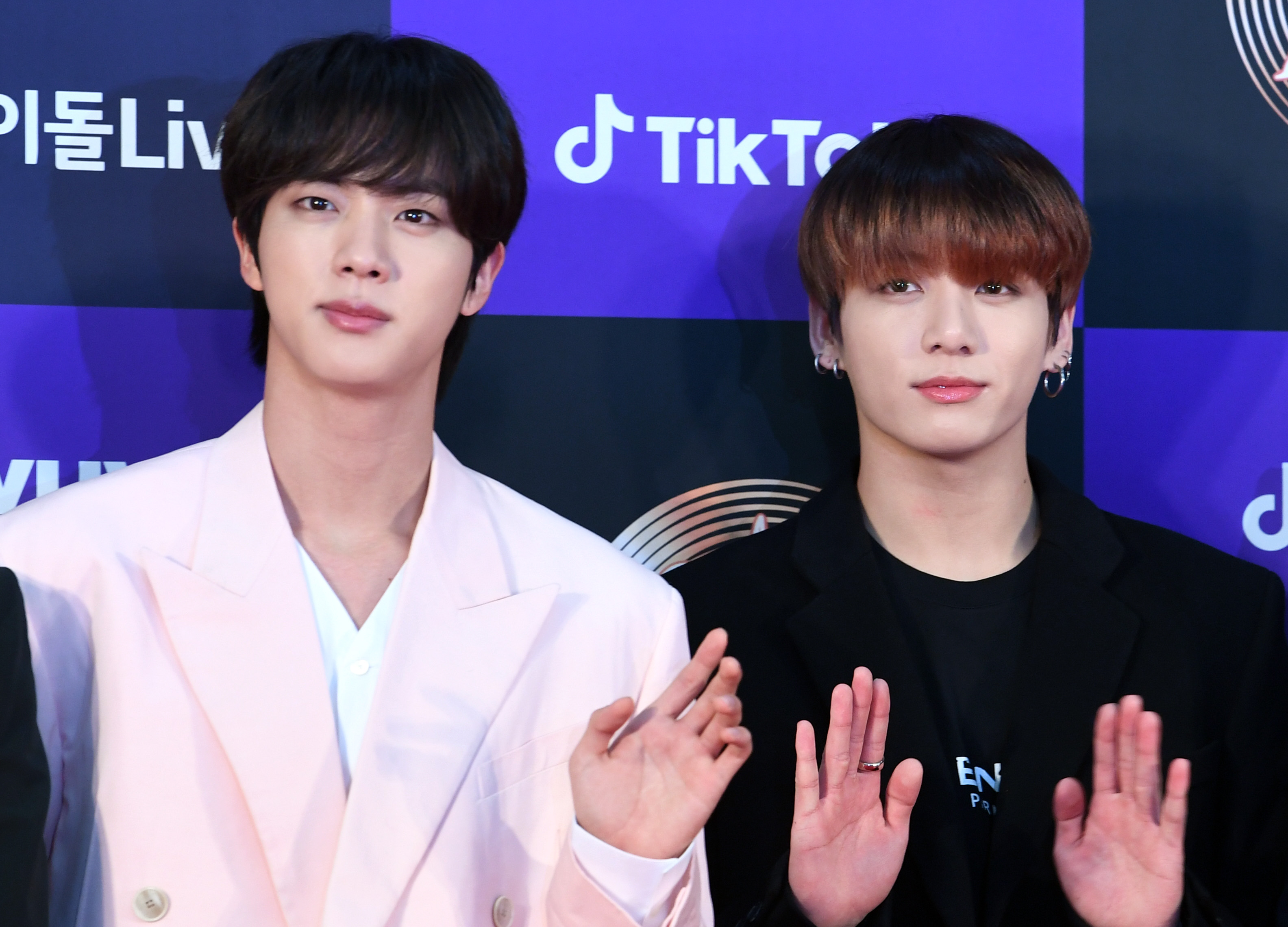 Jin and Jungkook of BTS arrives at the photo call for the 34th Golden Disc Awards