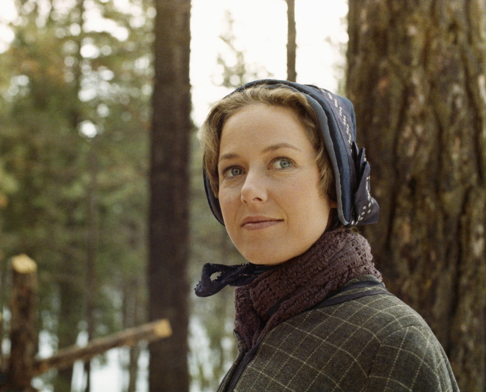 Karen Grassle as Caroline Quiner Holbrook Ingalls smiling in front of a tree
