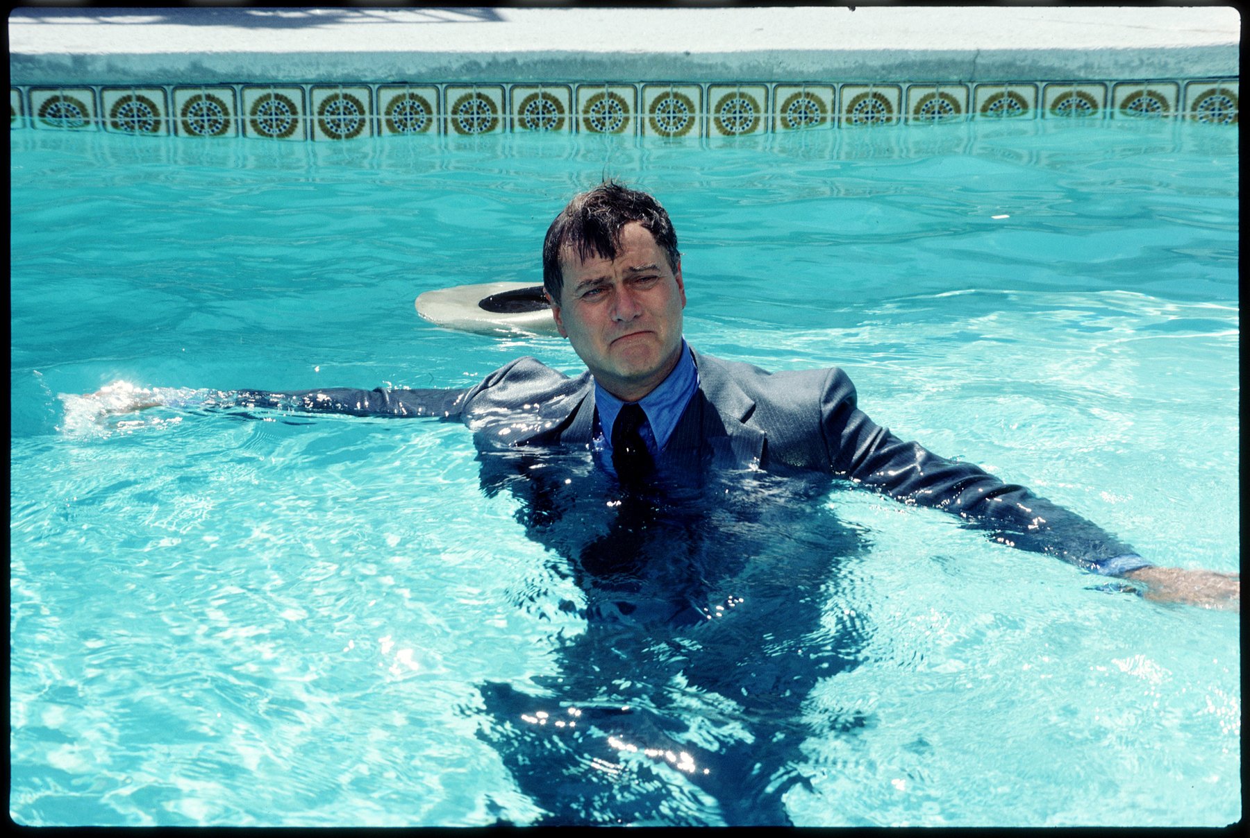Larry Hagman as John Ross 'J.R.' Ewing in a pool, frowning, on 'Dallas'