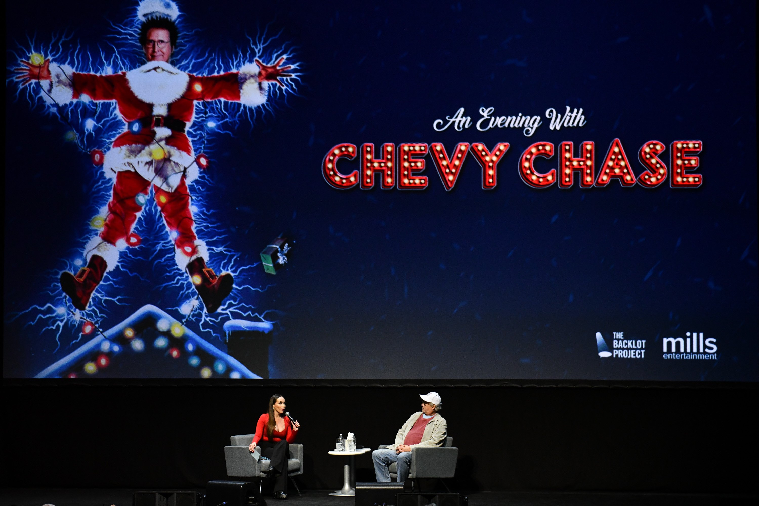 Chevy Chase of 'National Lampoon's Christmas Vacation' speaks with moderator Yenitza Munoz