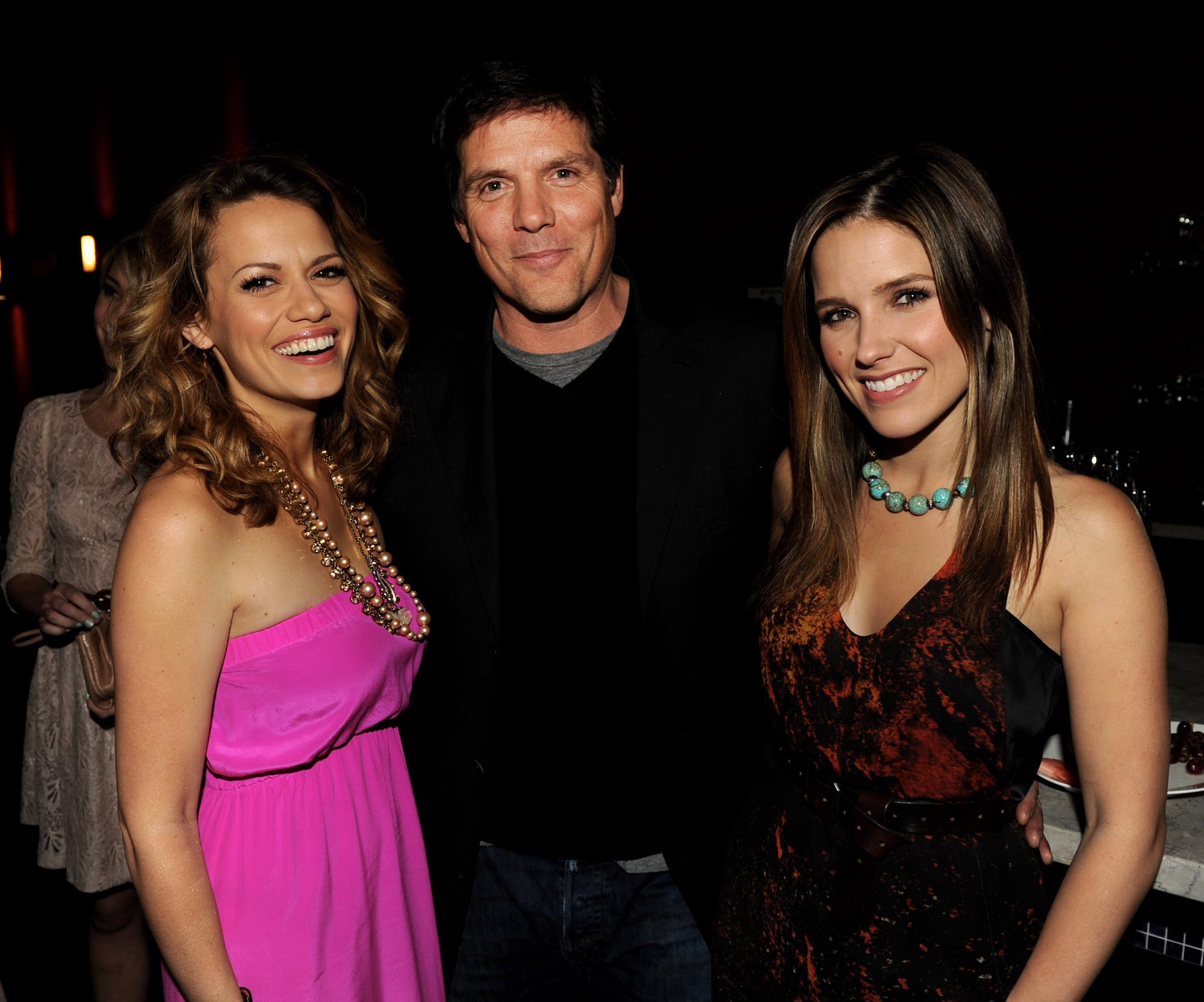 (L-R) Actors Bethany Joy Galeotti, Paul Johansson and Sophia Bush smiling