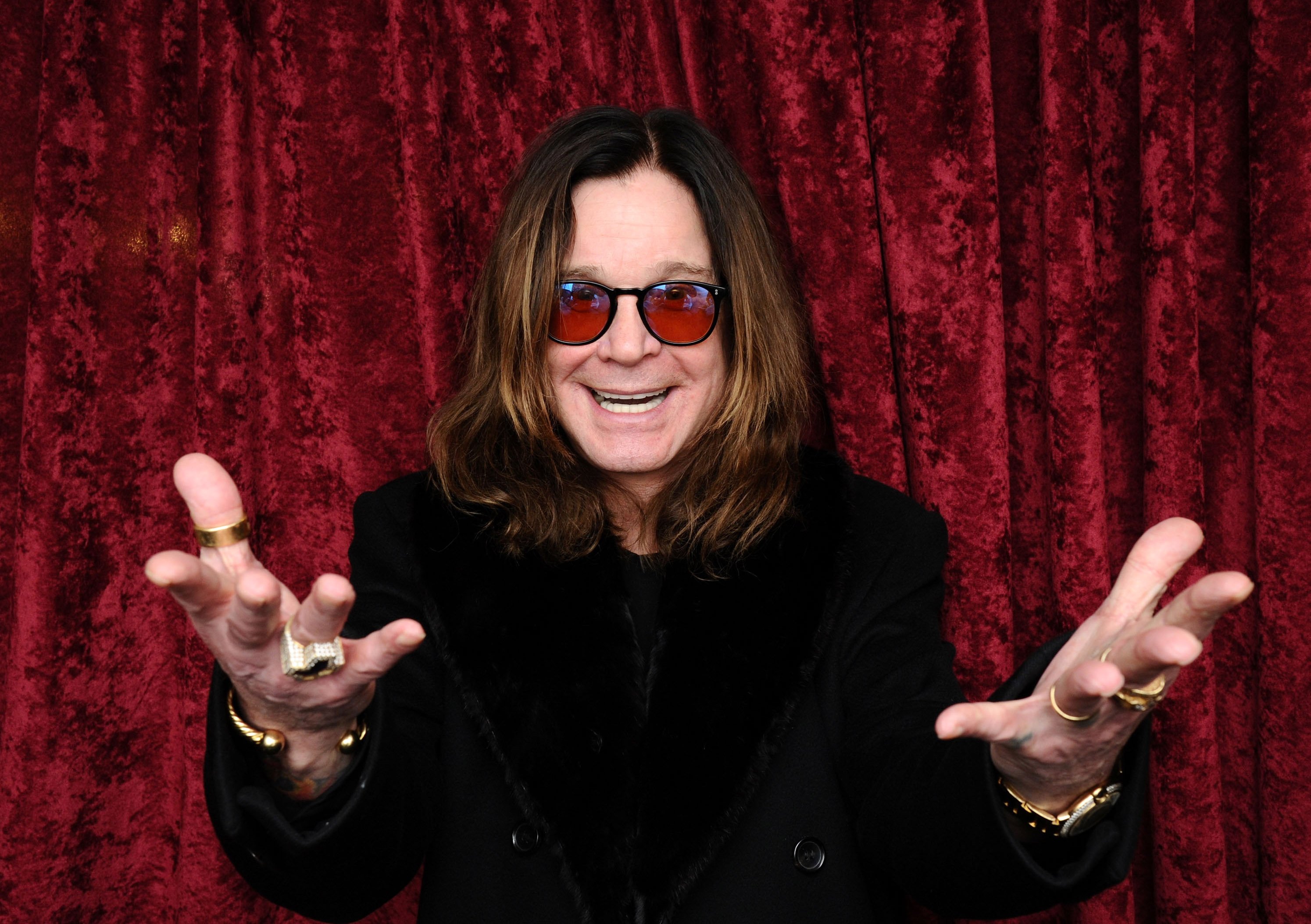 Ozzy Osbourne poses for a photo