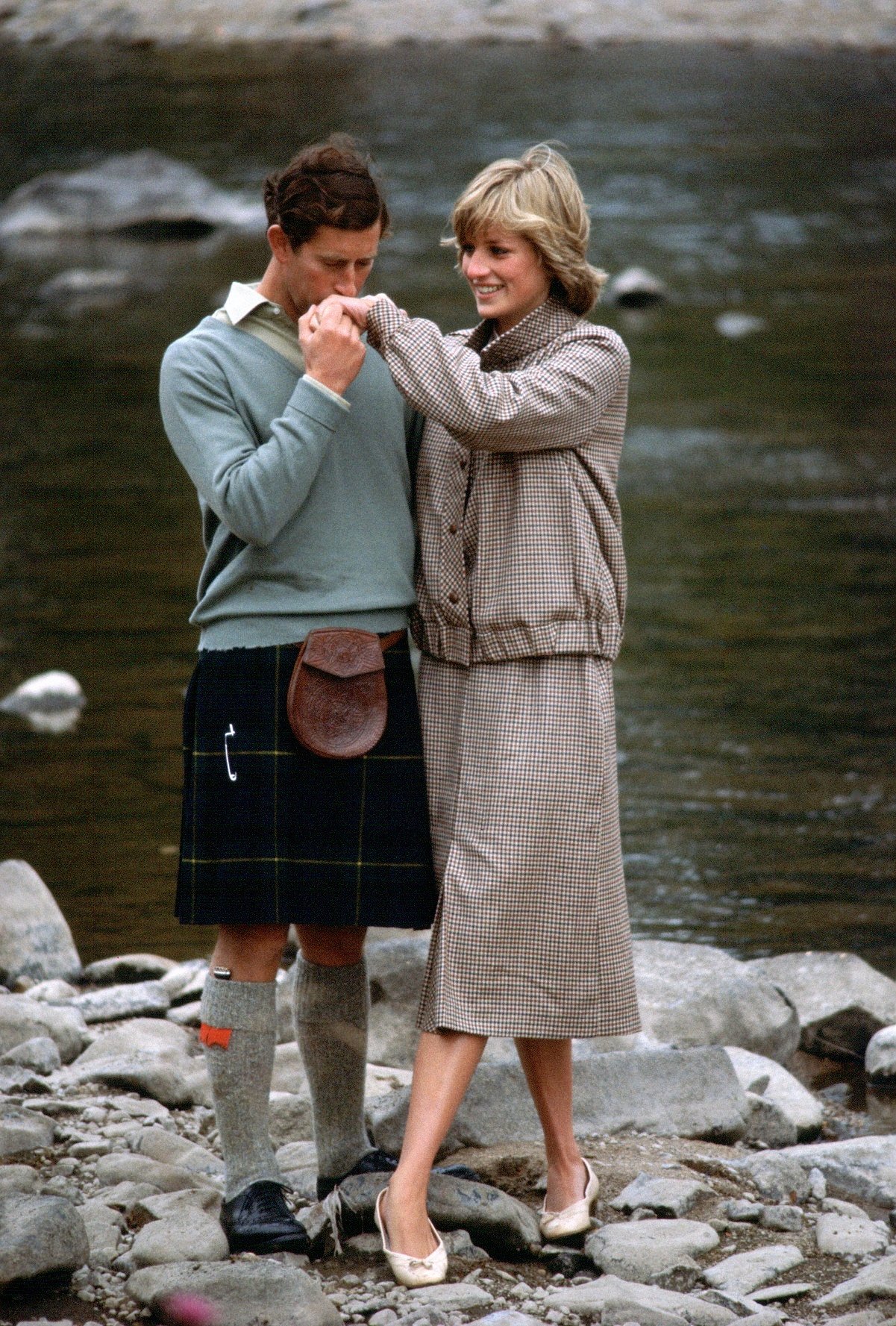 Prince Charles kissing Princess Diana's hand during their honeymoon at Balmoral