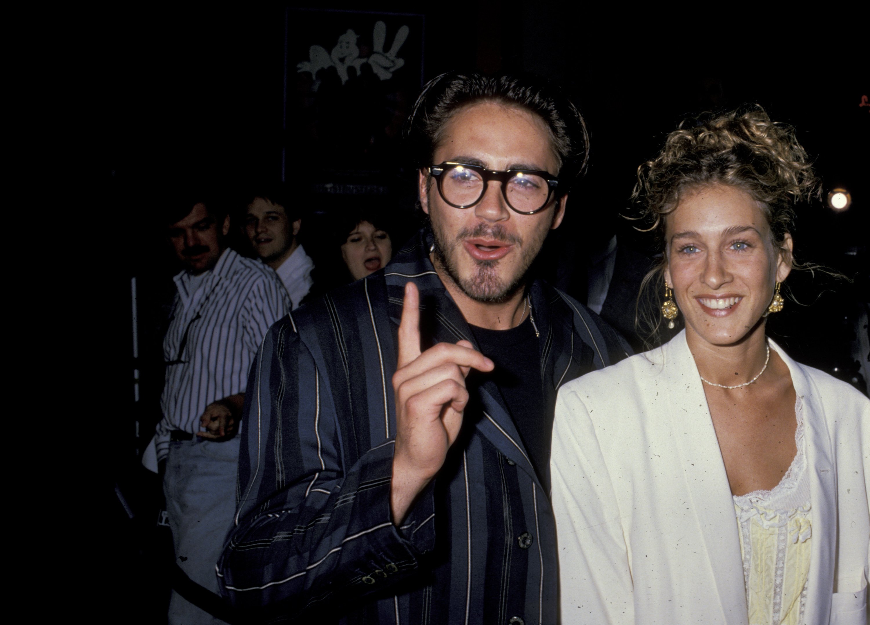 Sarah Jessica Parker and Robert Downey Jr. attend the 'Ghostbusters II' premiere in 1990
