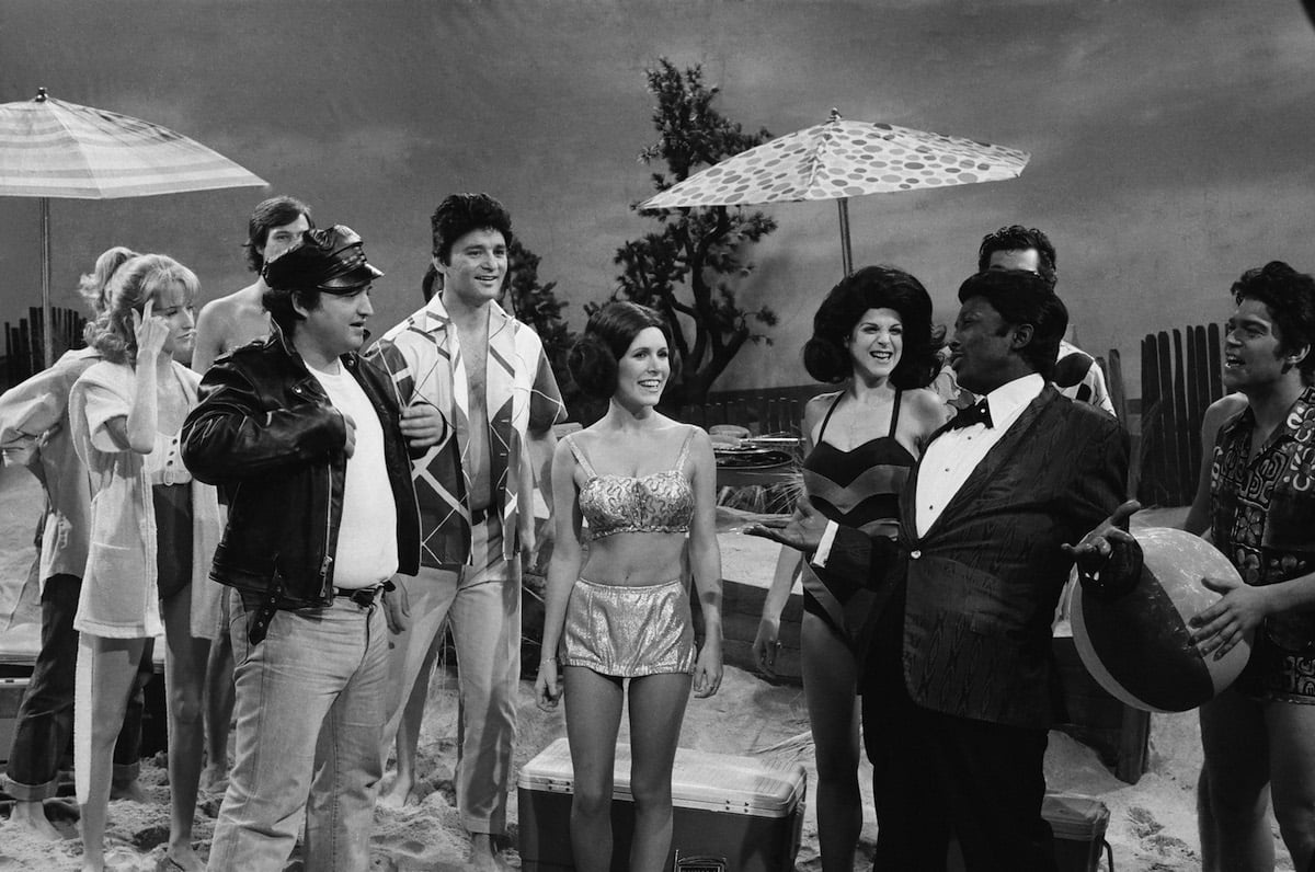 John Belushi as Eric Von Zipper, Bill Murray as Frankie Avalon, Carrie Fisher as Princess Leia, Gilda Radner as Annette Funicello, Garrett Morris as Chubby Checker during "Beach Blanket Bimbo from Outer Space" skit