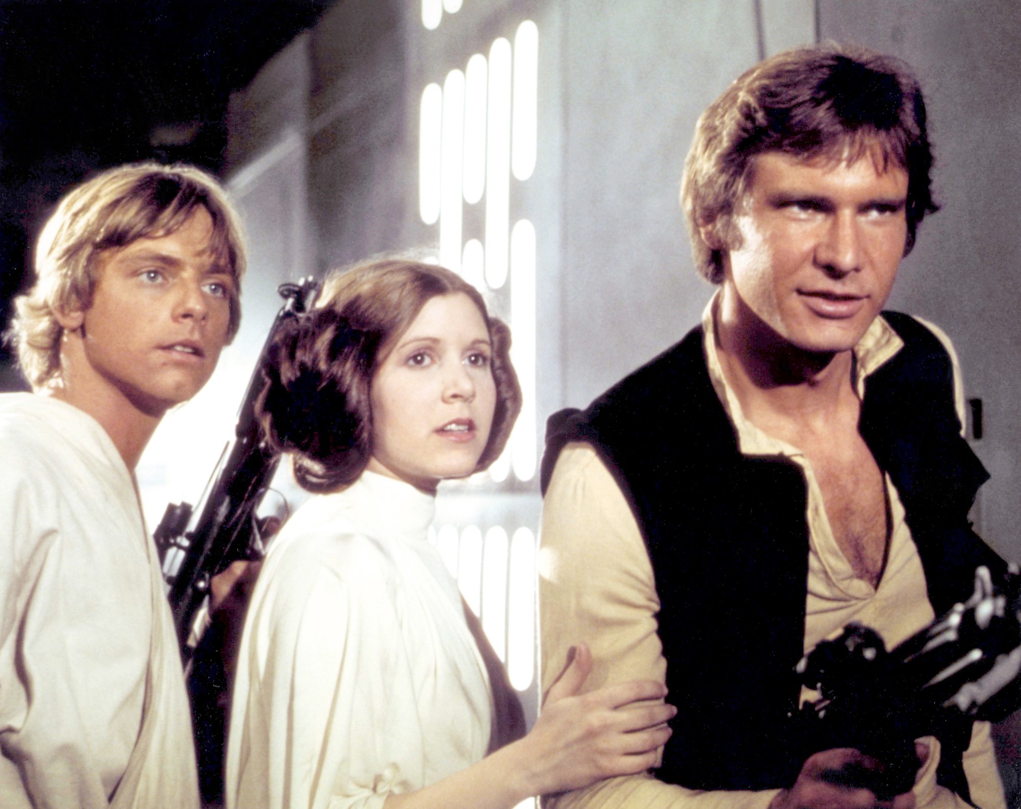 (L-R) Mark Hamill, Carrie Fisher and Harrison Ford in Star Wars: Episode IV - A New Hope