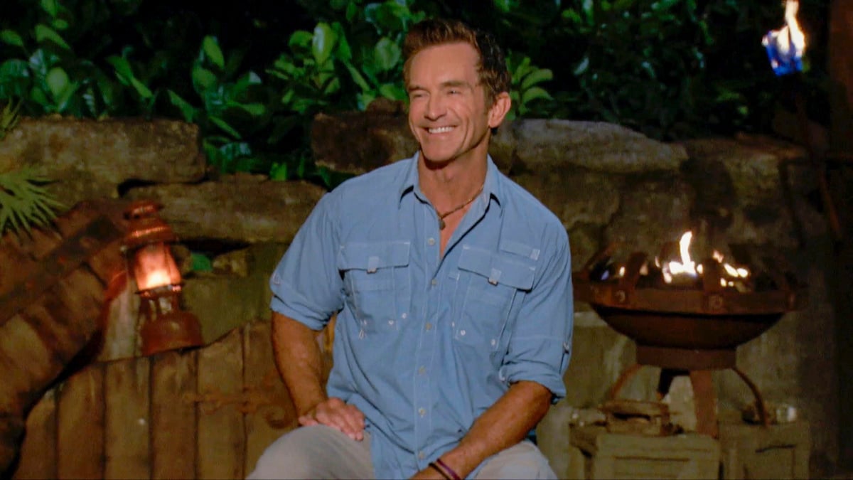 Jeff Probst on ‘Survivor: Winners at War,' wearing one of his signature blue button downs and smiling