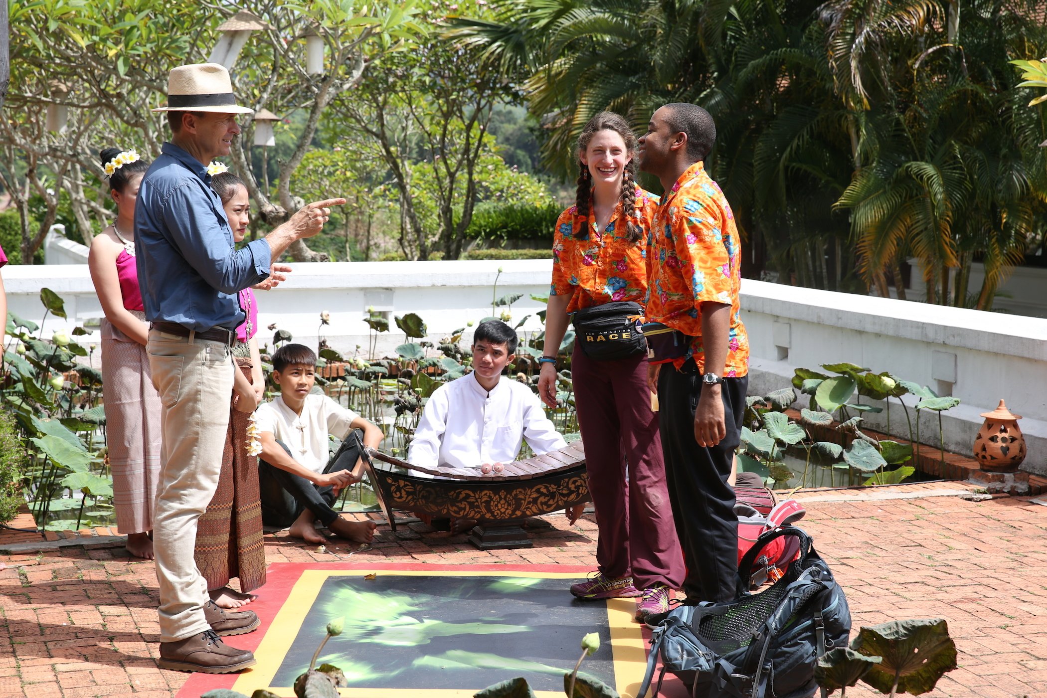 Host Phil Keoghan, Becca Droz, and Floyd Pierce on 'The Amazing Race'